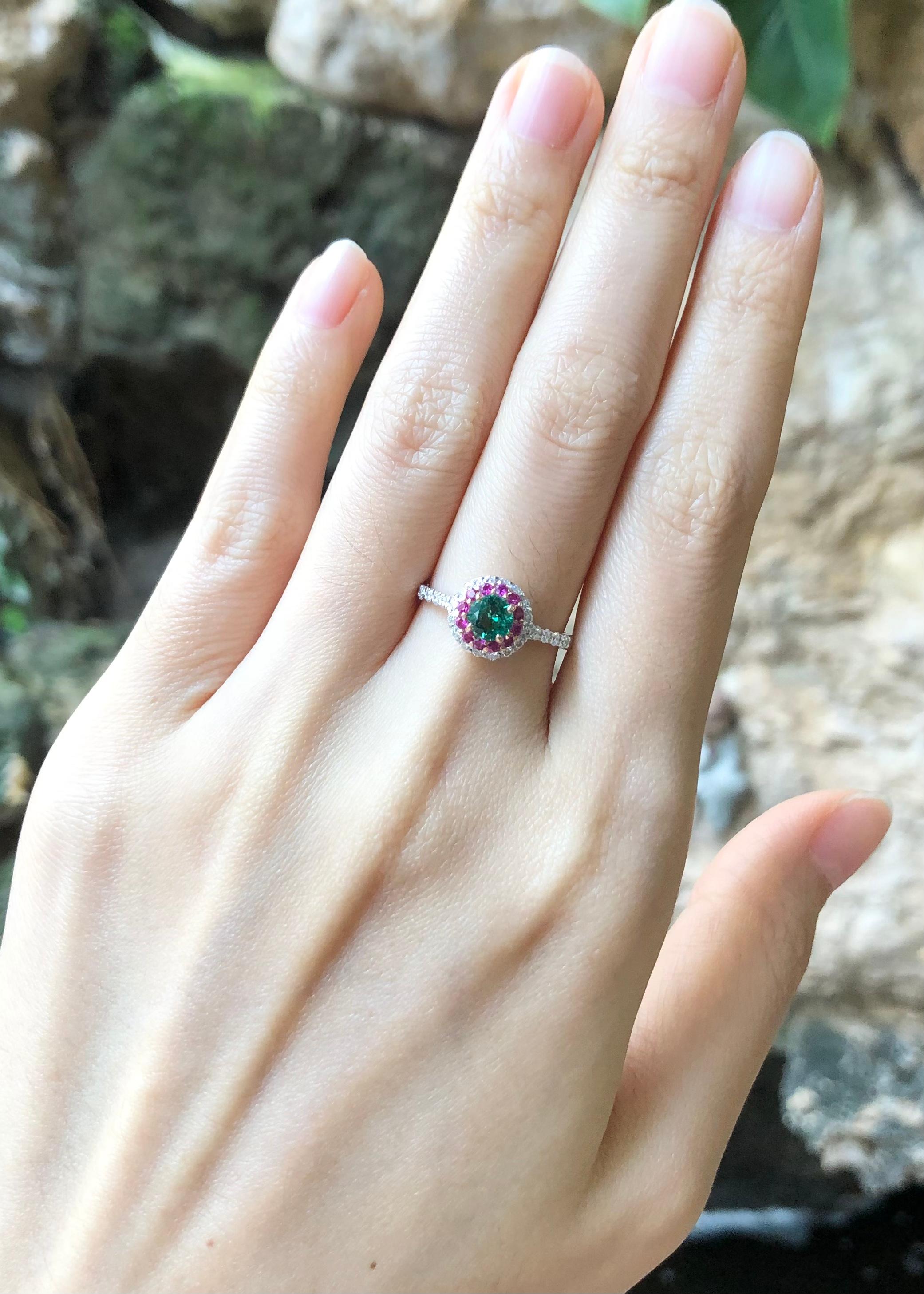 Emerald 0.46 carat, Pink Sapphire 0.19 carat and Diamond 0.28 carat Ring set in 18 Karat White Gold Settings

Width:  0.9 cm 
Length: 0.9 cm
Ring Size: 52
Total Weight: 2.63 grams



