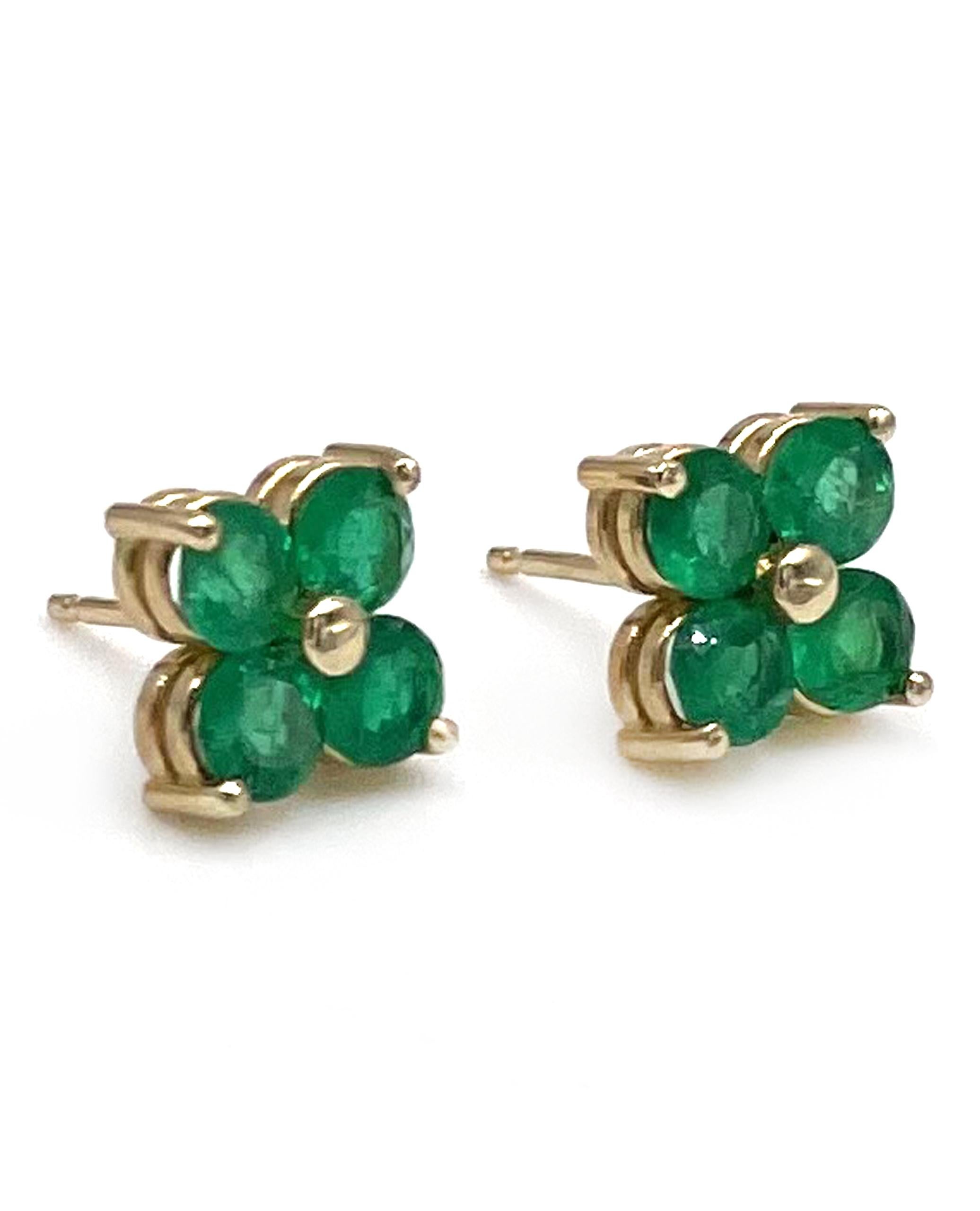 Pair of 14K yellow gold quatrefoil stud earrings with eight round emeralds 1.45 carats total weight.

* Jumbo earring push backs are included.