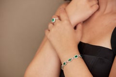 Bracciale con smeraldo a rettangolo e diamanti in oro bianco 18 carati