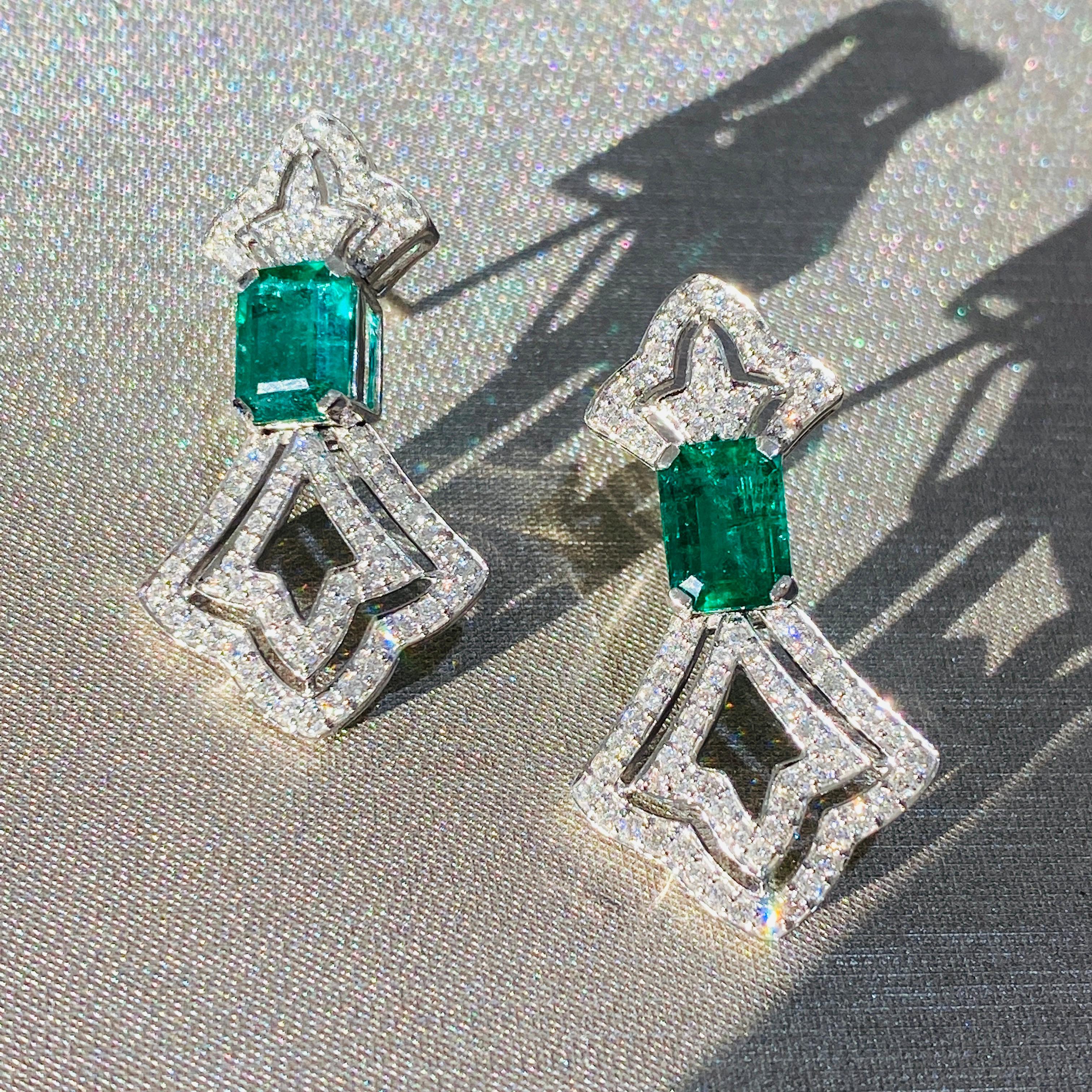 Tresor Diamond Earring features 0.94 cts diamond and 2.76 cts emerald in 18k white gold. The Earring are an ode to the luxurious yet classic beauty with sparkly diamonds. Their contemporary and modern design makes them versatile in their use. The