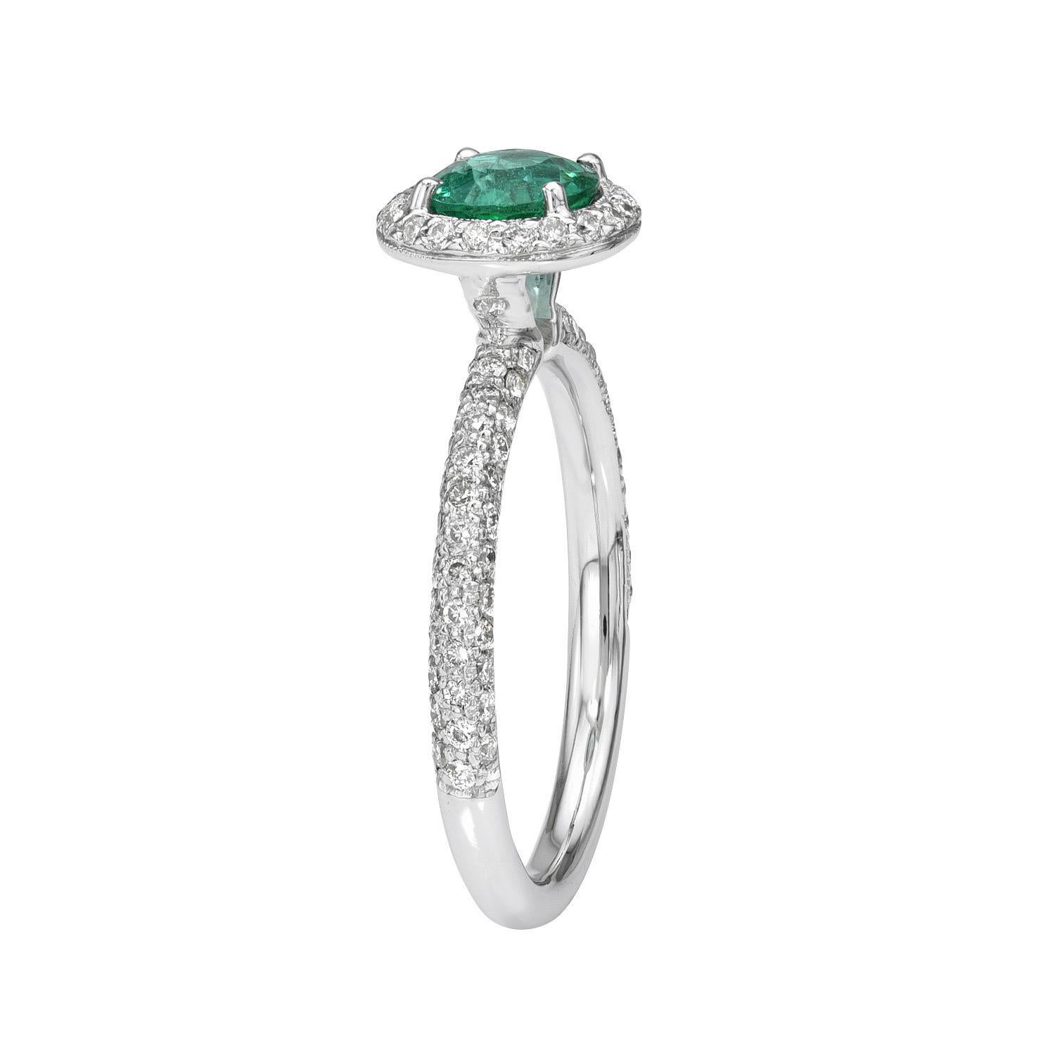 Vibrant 0.77 carat Emerald round 18K white gold engagement ring, decorated with round brilliant diamonds totaling 0.50 carats.
Ring size 6.5. Resizing is complementary upon request.
Returns are accepted and paid by us within 7 days of delivery.