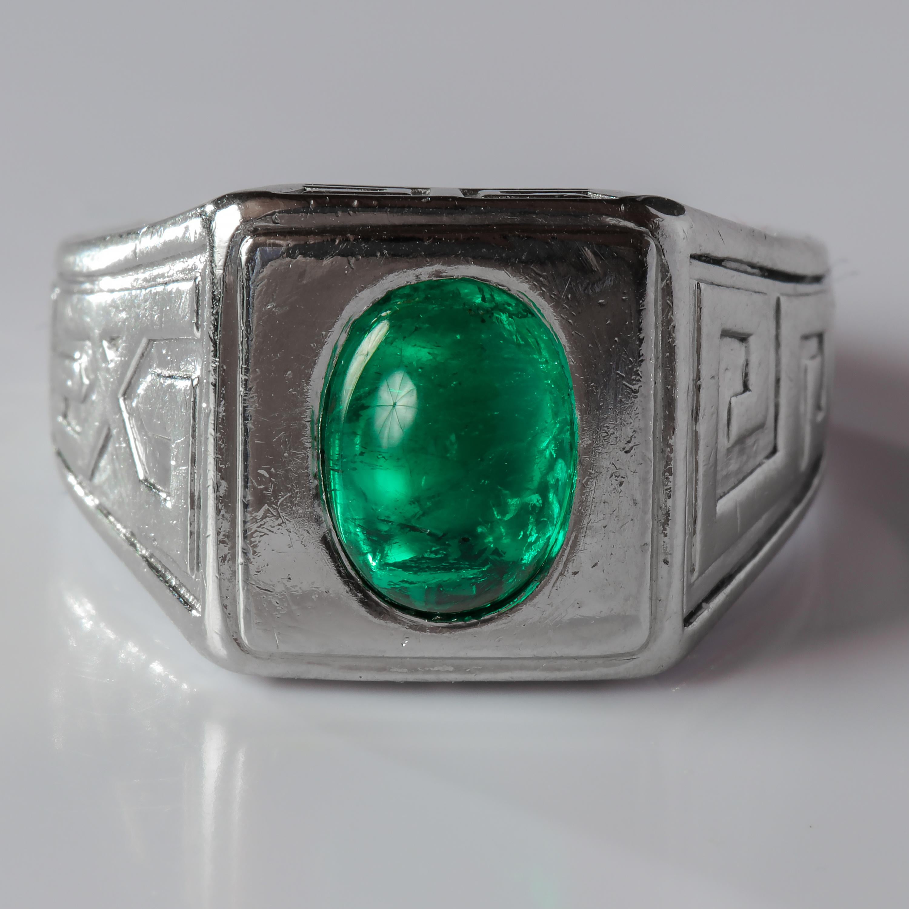 The emerald in this ring. I can't even. It's an 8.7mm x 6.5mm x 4.9mm cabochon-cut two-carat gem from Colombia, almost certainly from their legendary Muzo mines. The color is a richly saturated bluish-green —stunning. Quite literally emerald's