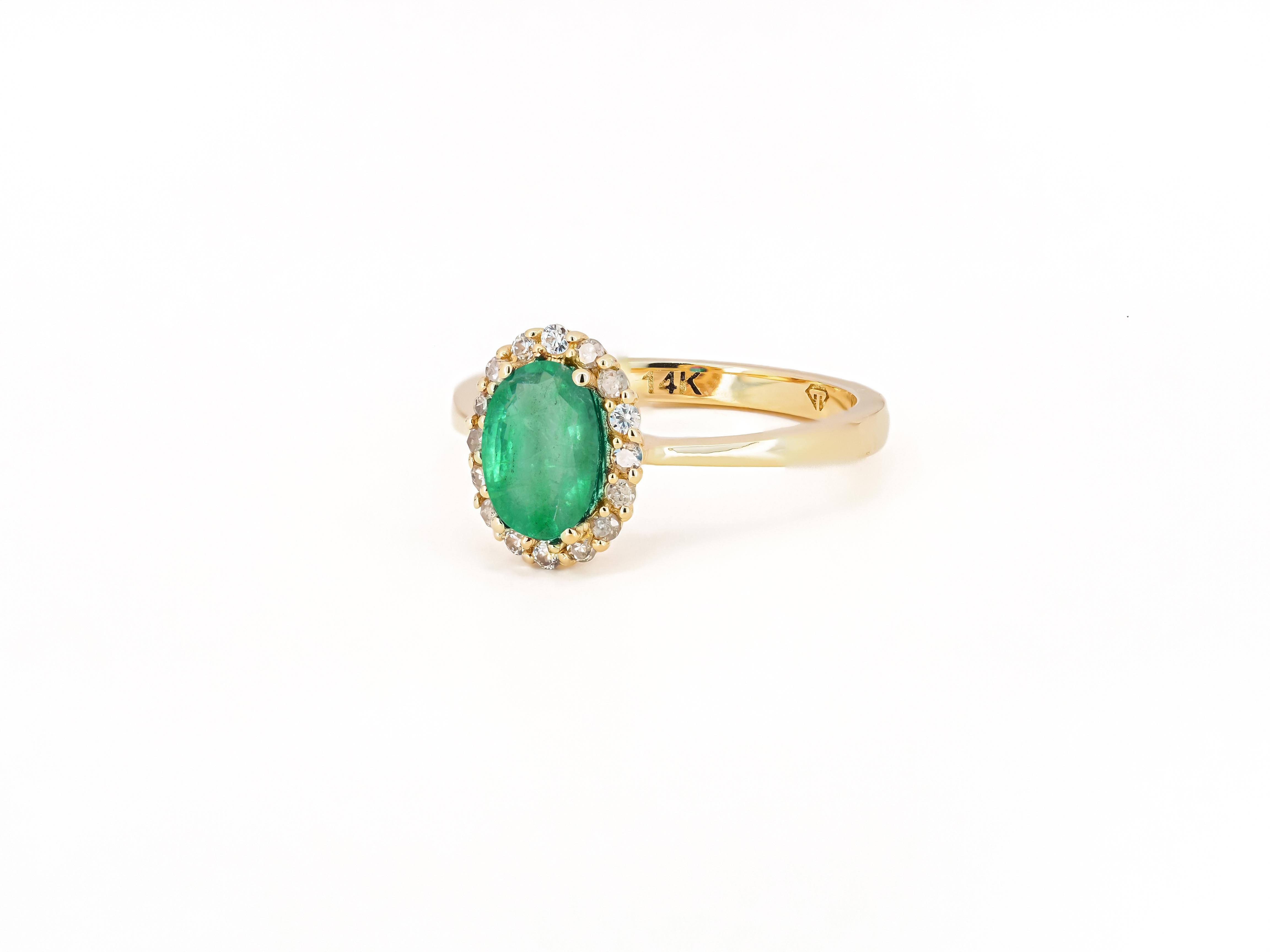 Modern Emerald ring with diamond halo. For Sale