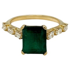 Emerald Ring with Emerald Cut Side Diamonds