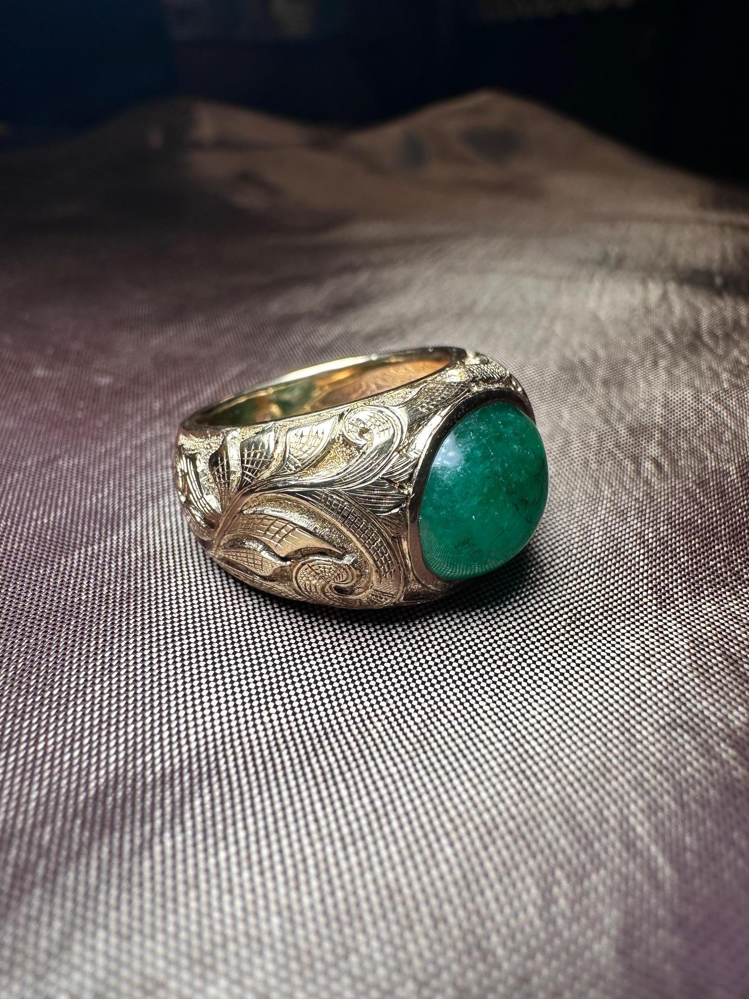 The emerald cabochon is a classic and timeless style, and our version adds a modern touch with its sleek and contemporary design. The emerald itself is of the highest quality, with its rich green color and beautiful clarity. The stone is set in 18k