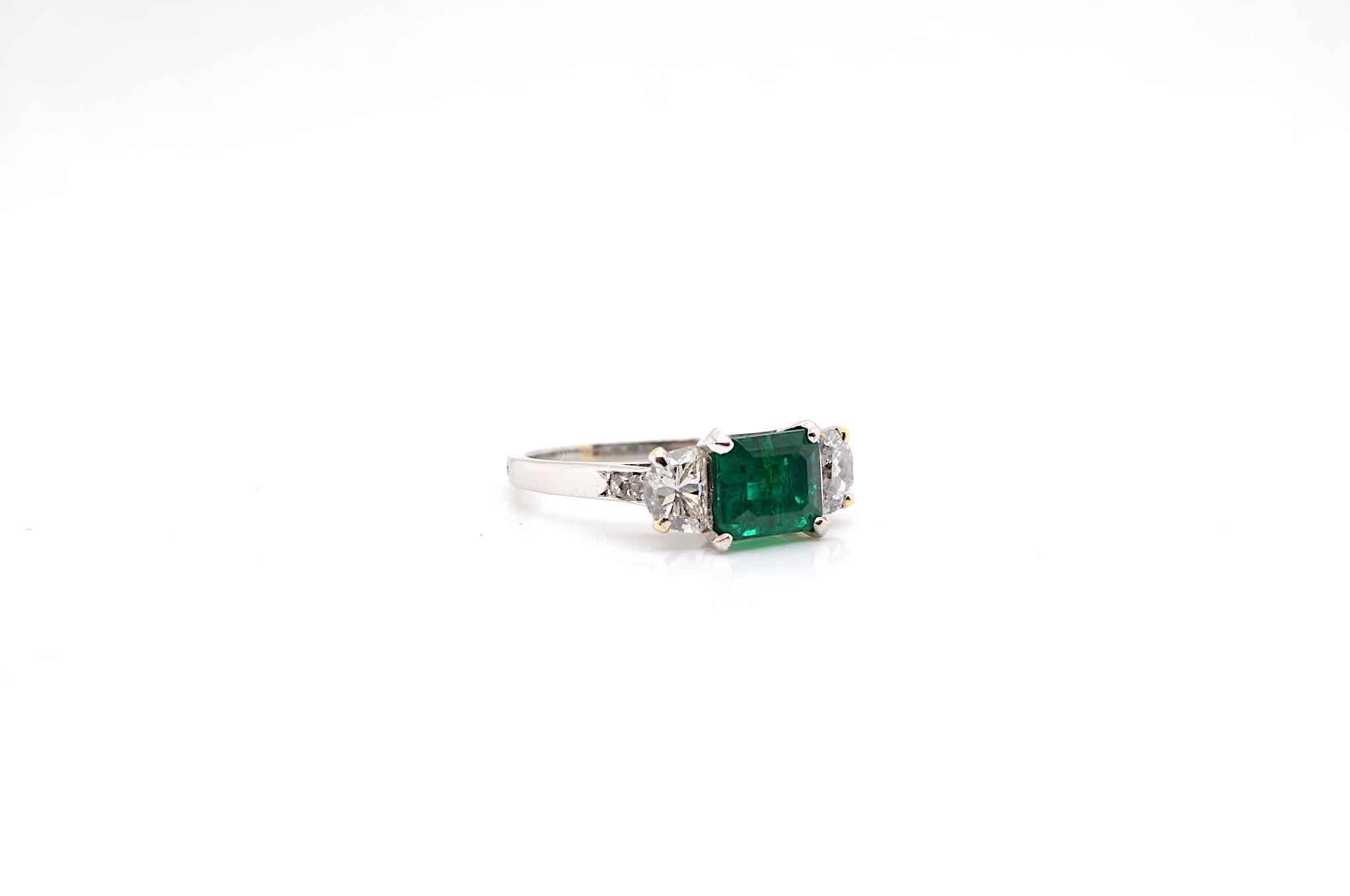 Emerald Cut Emerald ring with half-moon diamonds