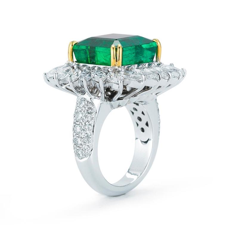 EMERALD RING WITH MARQUISE DIAMOND HALO A mesmerizing diamond marquis halo enhances the design flow of this stunning certified Emerald Item: # 01725 Metal: 18k W / Y Lab: Gia Color Weight: 15.80 ct. Diamond Weight: 5.78 ct.
