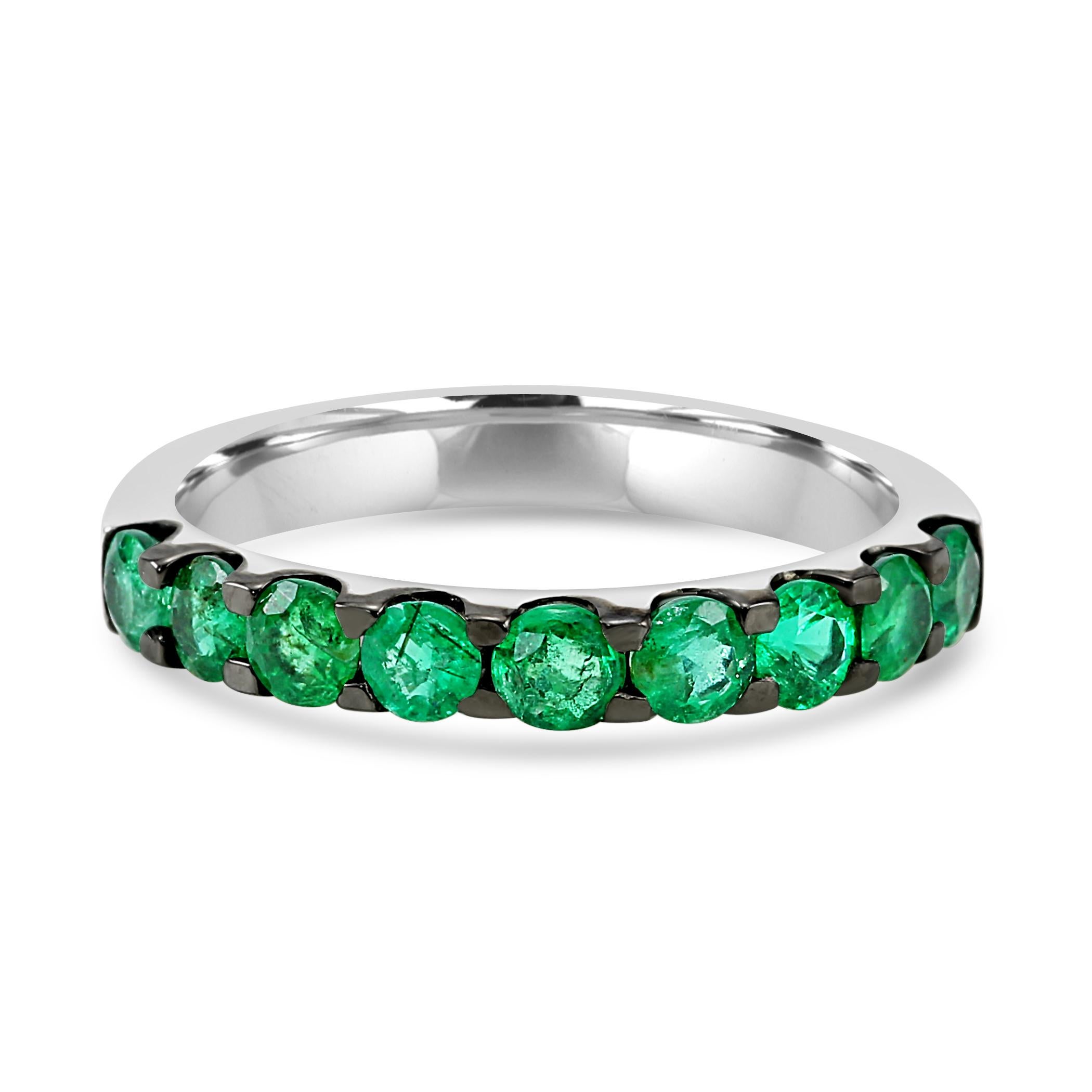 Embrace timeless elegance with our stunning engagement band ring!

The focal point of this ring are the gorgeous emerald rounds, totaling to 1.08 carats. Each emerald was carefully selected  for its vivid green color and exceptional clarity,