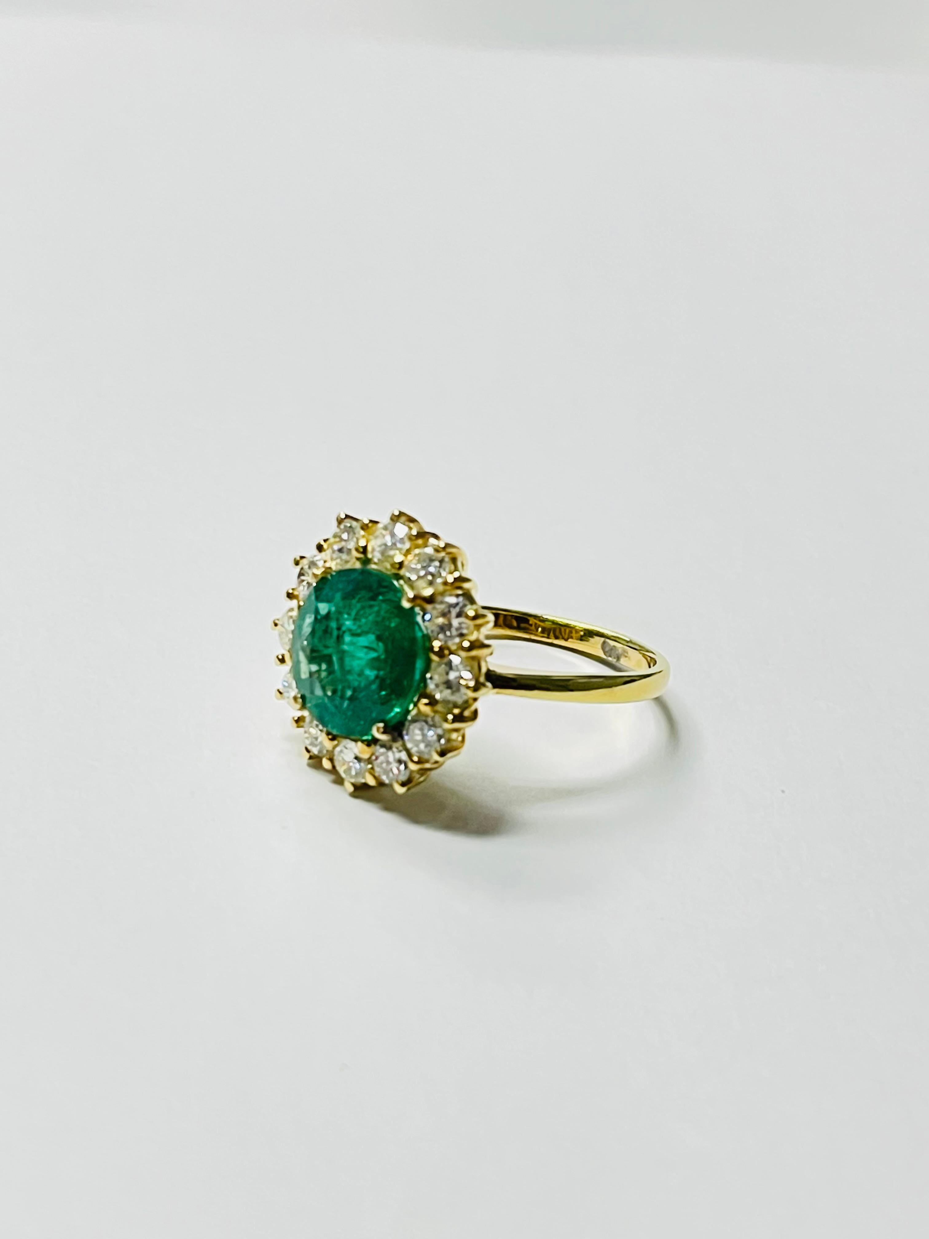 Gorgeous round emerald and diamond engagement ring beautifully handcrafted in 18k yellow gold. 
The ring looks more beautiful and attractive in person than shown in the pictures. 

The details are as follows : 

Emerald weight : 4.50 carat 
Diamond