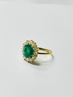 Emerald Round and Diamond Engagement Ring In 18k Yellow Gold.