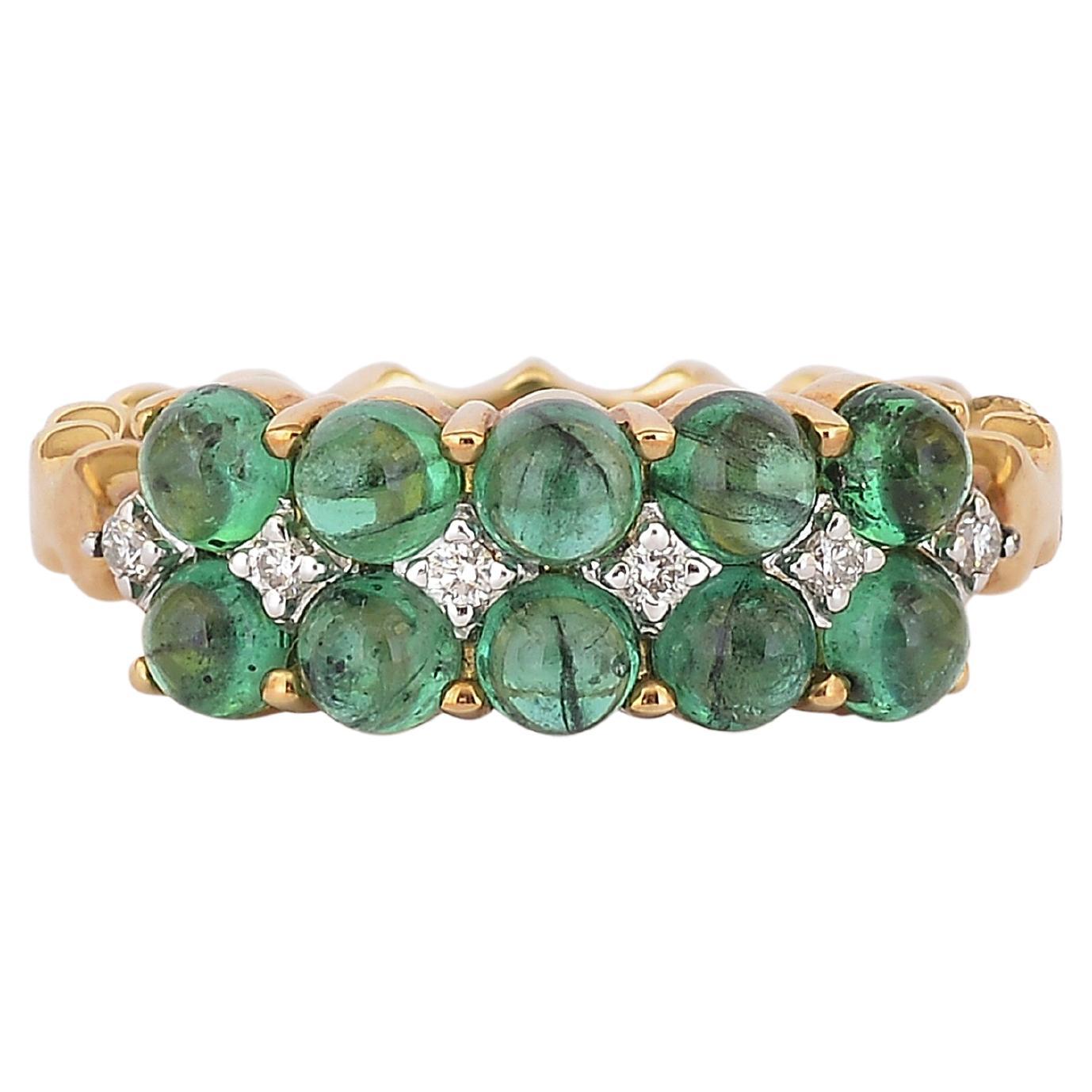A elegant, dainty yet bold ring with fine quality Emerald Round Cabochons set in a row one under the other with white diamonds. The shiny Emeralds look even nicer when light passes through them.
We have used top quality diamonds in the ring. 
Its