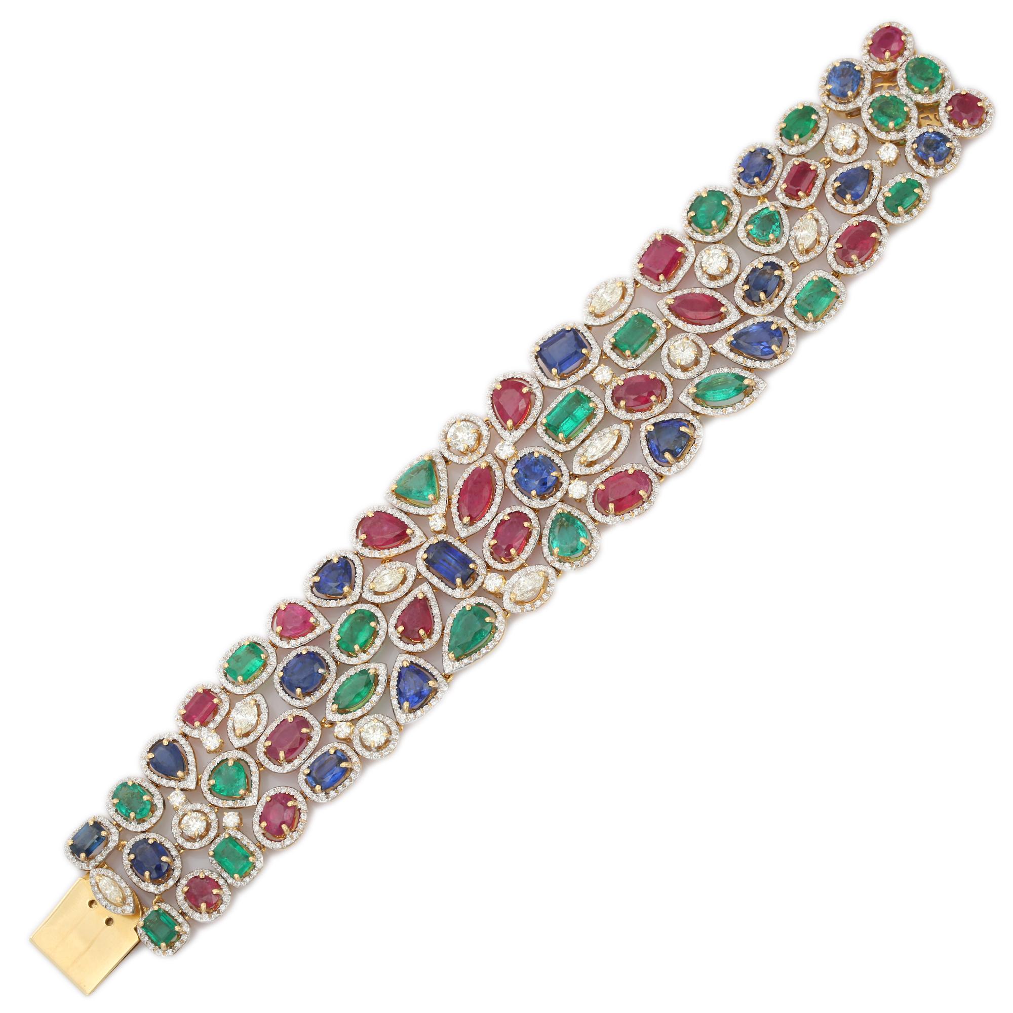 This Glorious 54.5 ct Emerald Ruby Sapphire Bracelet with Diamonds in 18K gold showcases 55 endlessly sparkling natural emerald, ruby and sapphire weighing 54.5 carats with diamonds of 8.4 carats. It measures 7.5 inches long in length. 
Emerald