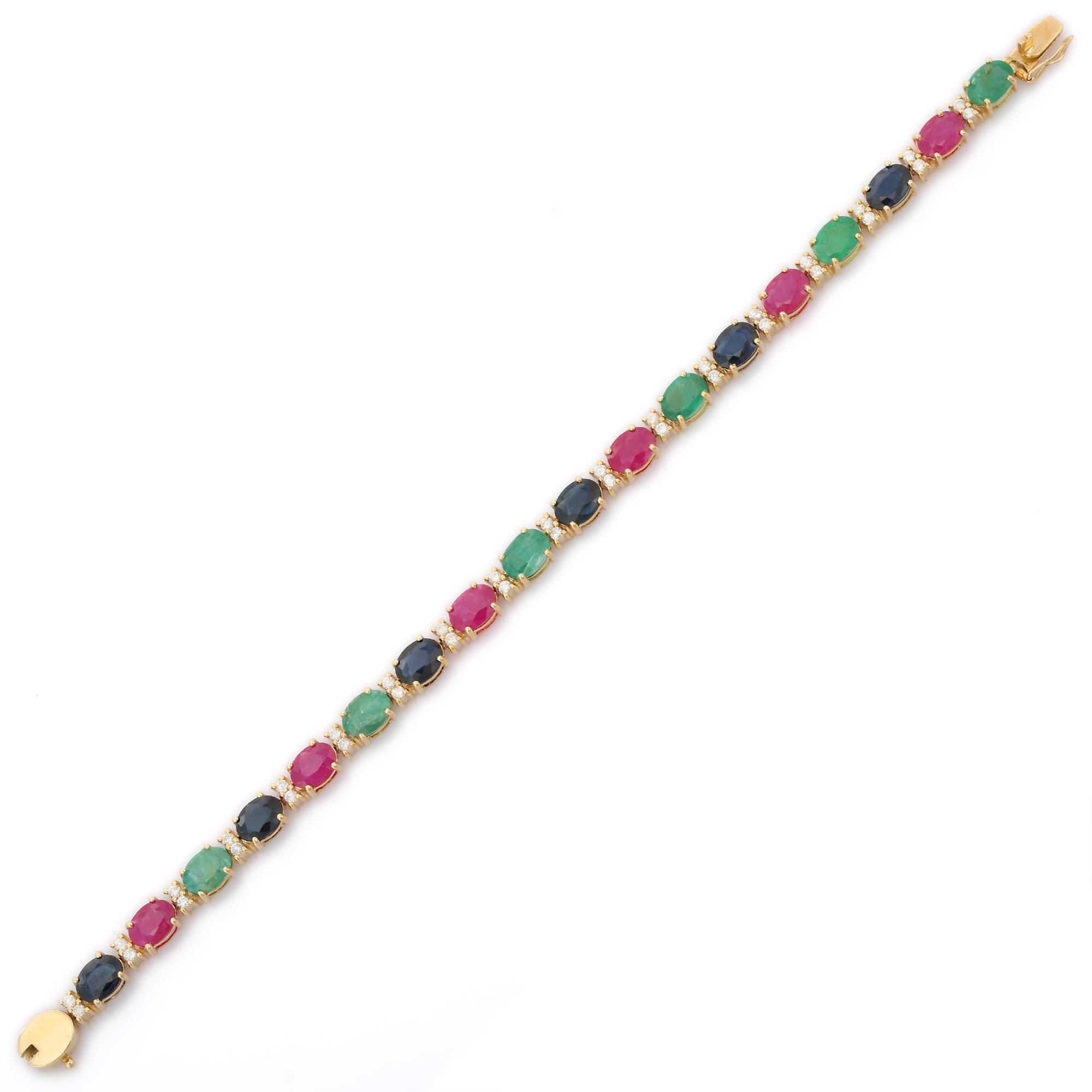 This Glamorous Emerald, Ruby and Sapphire Tennis Bracelet with Diamonds in 14K gold showcases 18 endlessly sparkling natural emerald, ruby, sapphire, weighing 15.01 carat. It measures 7.25 inches long in length. 
Emerald enhances intellectual