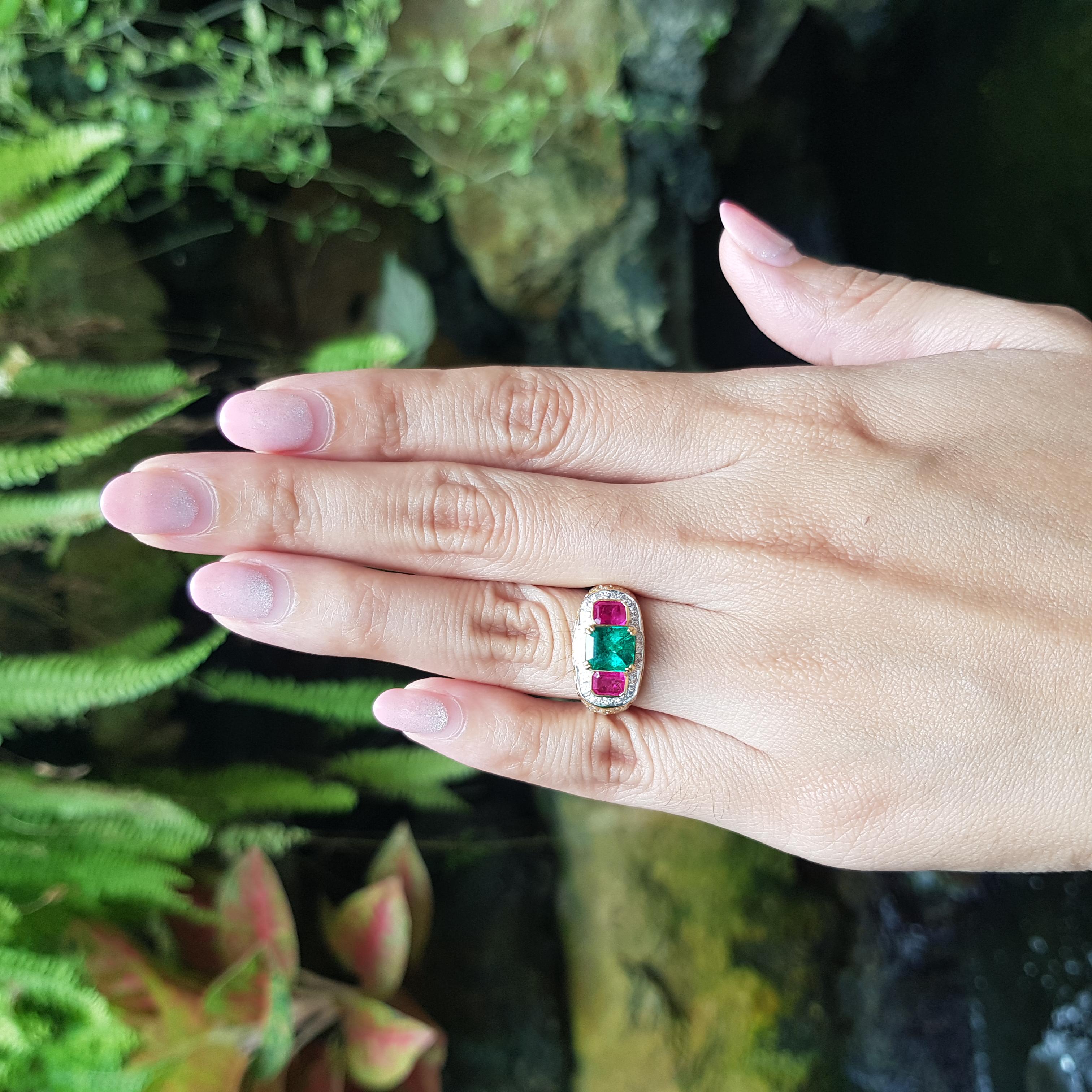 Emerald 1.29 carats, Ruby 0.86 carat and Diamond 0.67 carat Ring set in 18K Gold Settings

Width:  1.7 cm 
Length: 1.0 cm
Ring Size: 49
Total Weight: 5.85 grams

