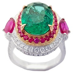 Emerald, Ruby and Diamond Ring set in 18K White Gold Settings