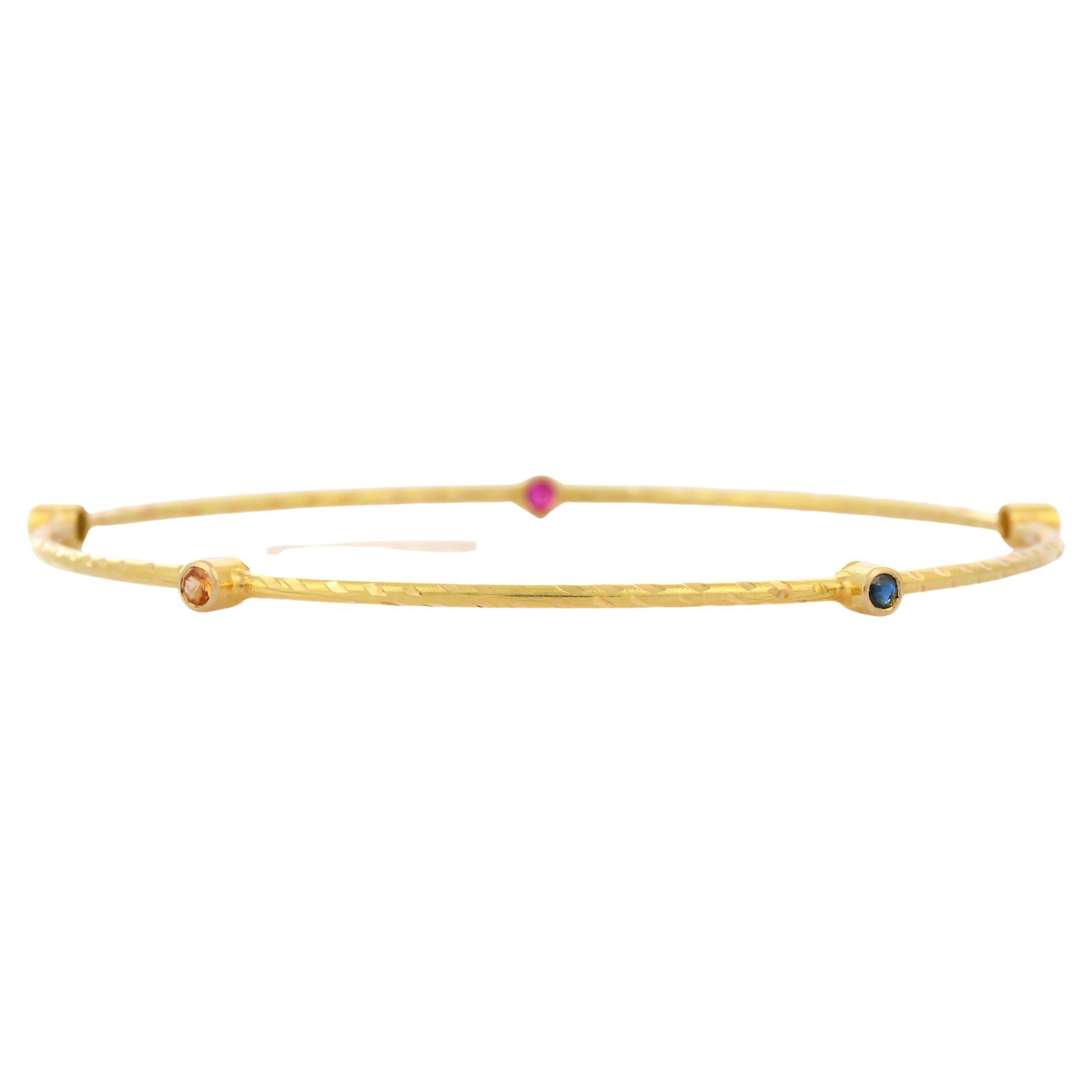 Modern Natural Emerald Ruby and Sapphire Bangle in 18K Solid Yellow Gold For Sale