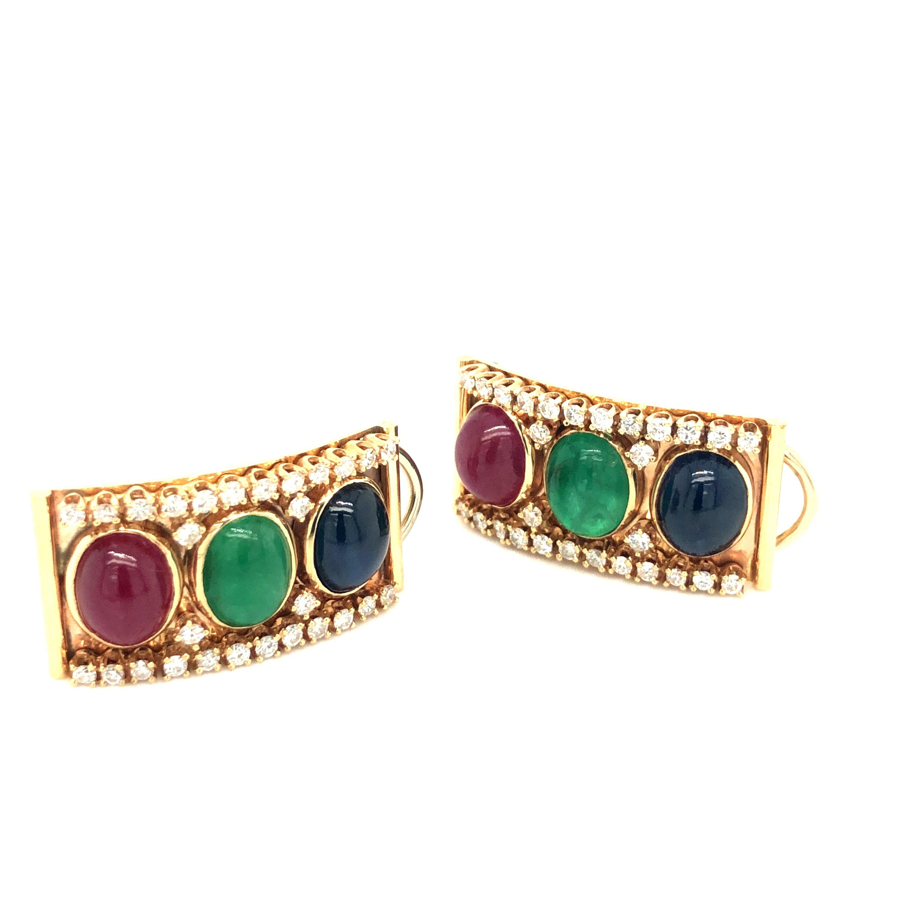 Stunning pair of 1970-80 14kt gold earring, featuring 6 natural earth mined Rubies, sapphires and emeralds weighing approximately 19 carats together.
Earrings are further adorned with 56 natural earth mined diamonds weighing appro. 0.60 ct averaging
