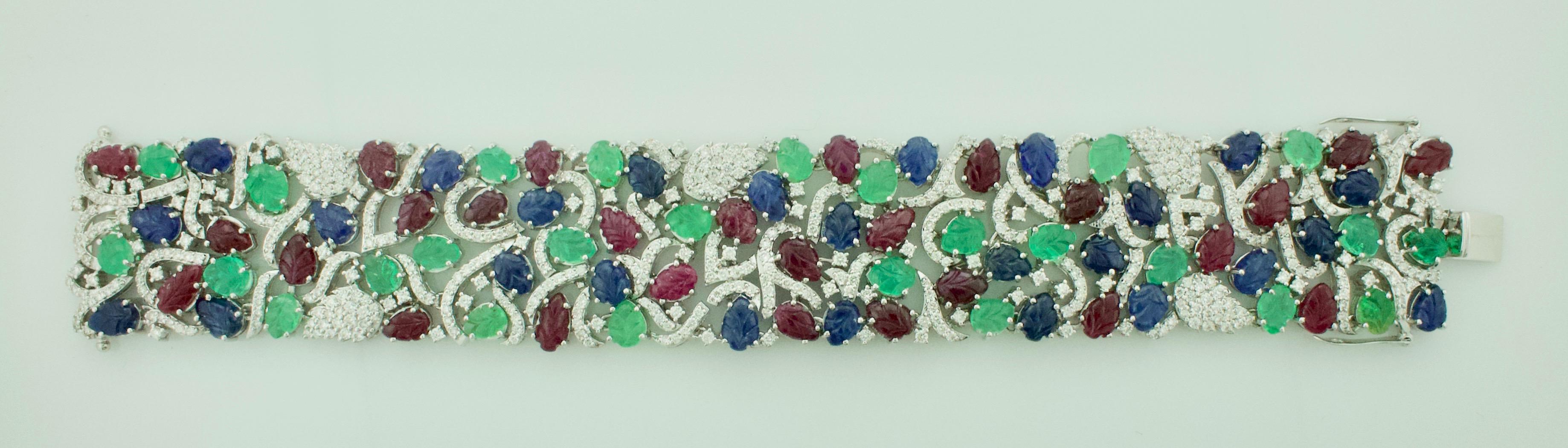 Emerald, Ruby and Sapphire Diamond Bracelet 18 Karat Wide
Discover the Allure of Timeless Elegance with the 18K White Gold Diamond/Sapphire, Ruby & Emerald 
