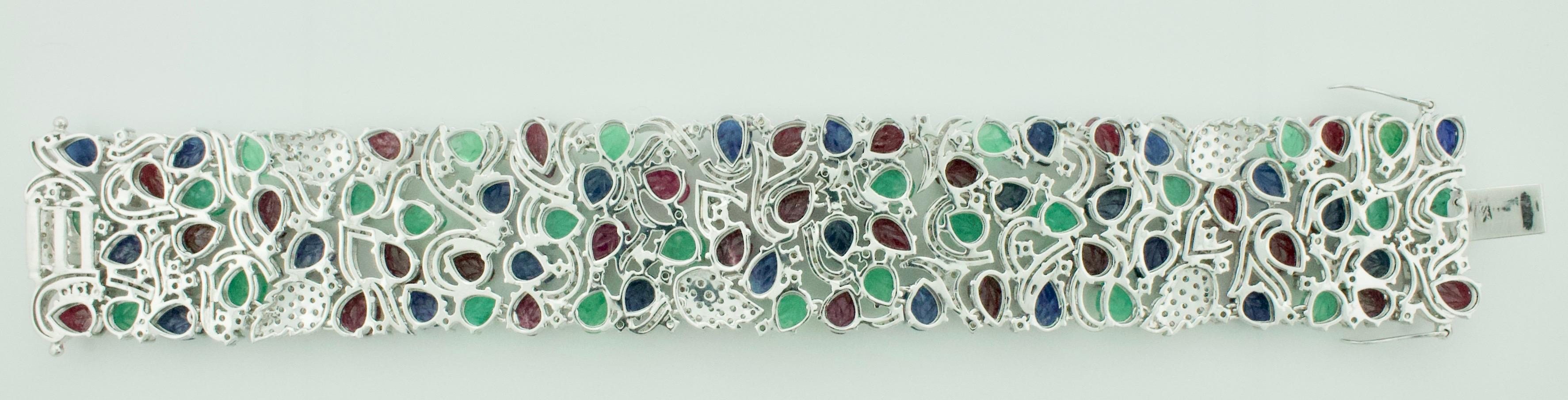 Art Deco Emerald, Ruby and Sapphire Diamond Bracelet 18 Karat Wide For Sale