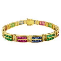 Pulsera de esmeralda, rubí, zafiro azul y diamantes engastada en oro de 18 quilates
