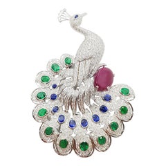 Emerald, Ruby, Blue Sapphire and Diamond Peacock Brooch in 18 Karat White Gold