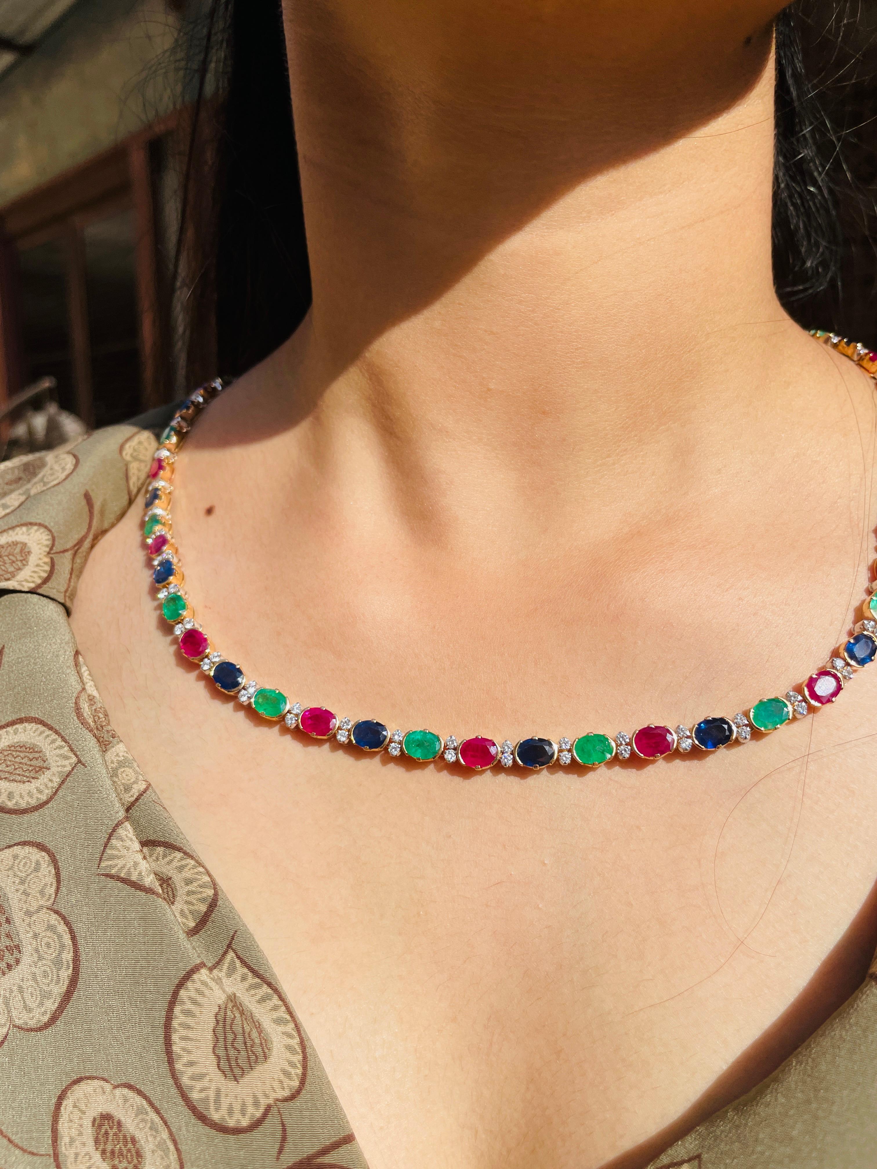 Multi Gemstone Necklace in 18K Gold studded with oval cut emerald, ruby, sapphire pieces and diamonds.
Accessorize your look with this elegant multi gemstone beaded necklace. This stunning piece of jewelry instantly elevates a casual look or dressy