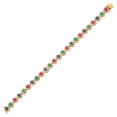 Armband aus 18 Karat Gelbgold mit Smaragd, Rubin, blauem Saphir und Diamant