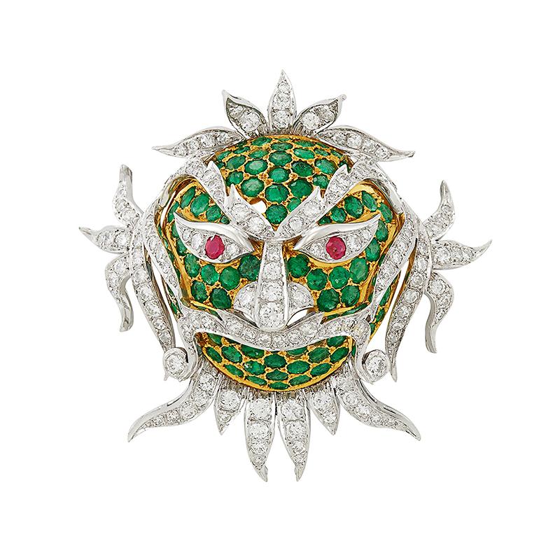 A Two-Color Gold, Diamond and Emerald and Ruby Mask Brooch of Chinese inspiration. 18 kt. yellow & white gold, round emeralds, round & single-cut diamonds ap. 2.50 cts., ap. 14.6 dwts. Circa 1960s


1 15/16 x 2 inches. 