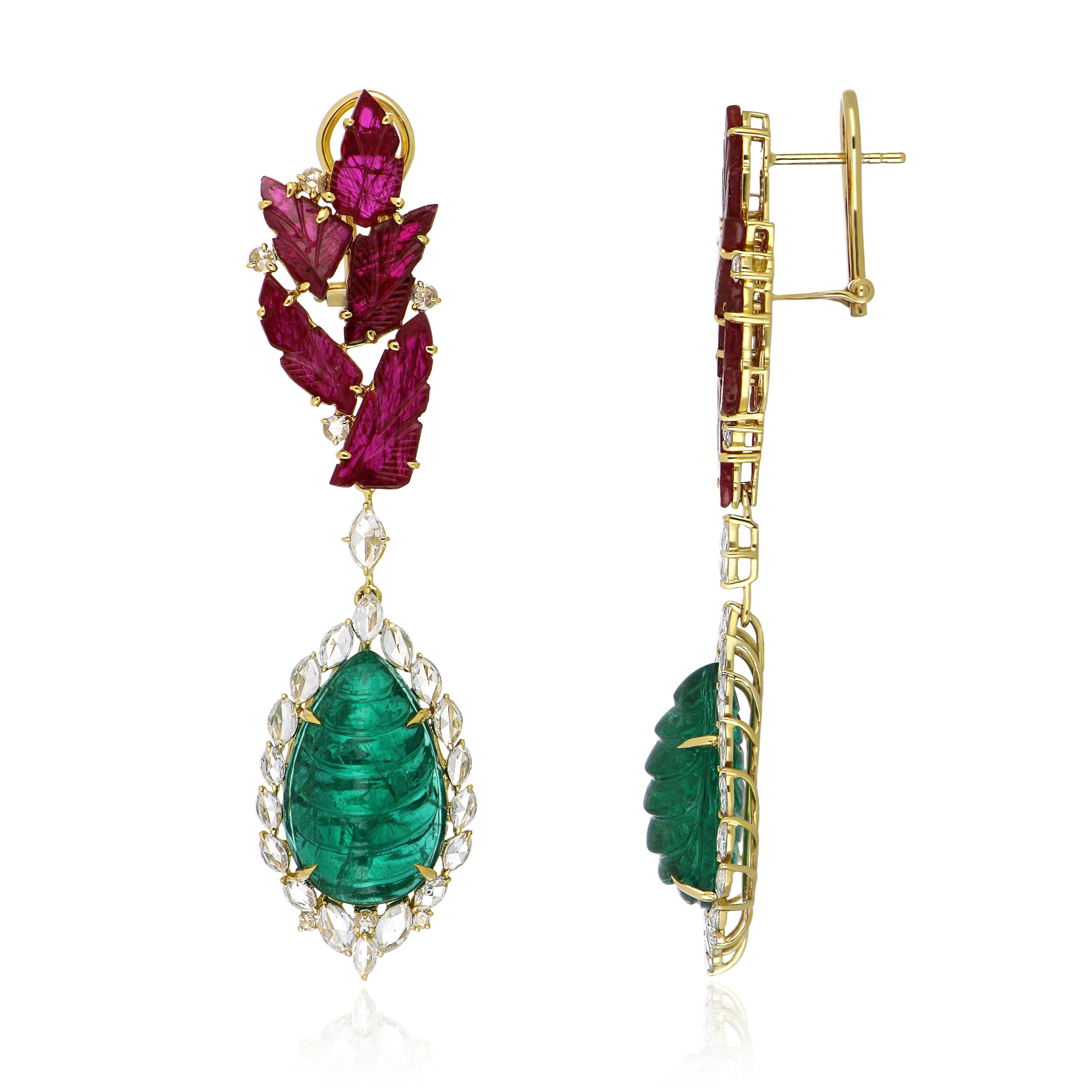 18 Karat Yellow Gold Earrings studded with beautifully Hand Carved Emerald Pear Cabochon Weighing around 24.00 Cts (total wt.) surrounded with beautiful halo of Marquise shaped Rose Cut diamonds weighing approx. 1.67 Cts (total wt.). Further