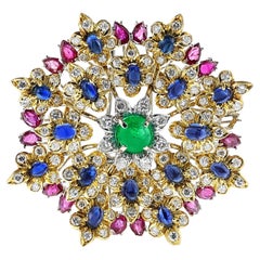 Broche émeraude, rubis, saphir et diamants, or 18 carats et platine