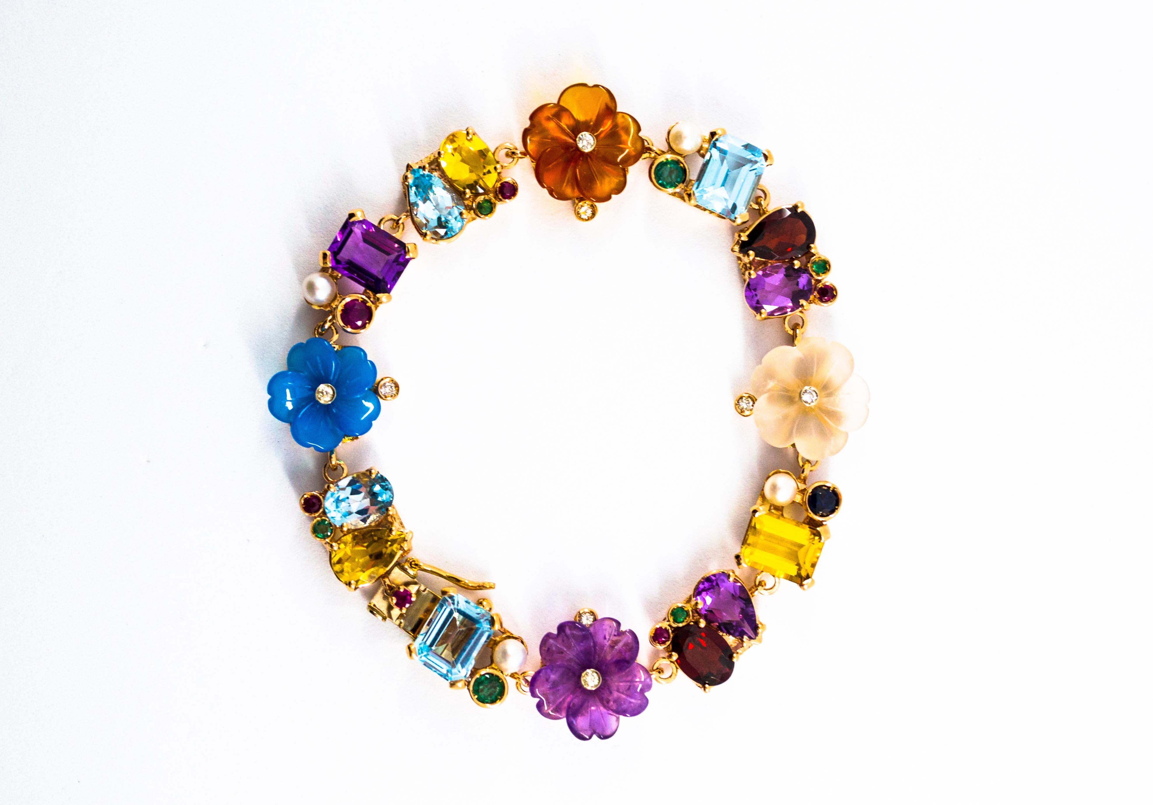 This Bracelet is made of 14K Yellow Gold but we can make it also in 9 or 18K Yellow Gold.
This Bracelet has 0.20 Carats of White Diamonds.
This Bracelet has 0.90 Carats of Blue Sapphires, Rubies and Emeralds.
This Bracelet has also Topaz, Amethyst,