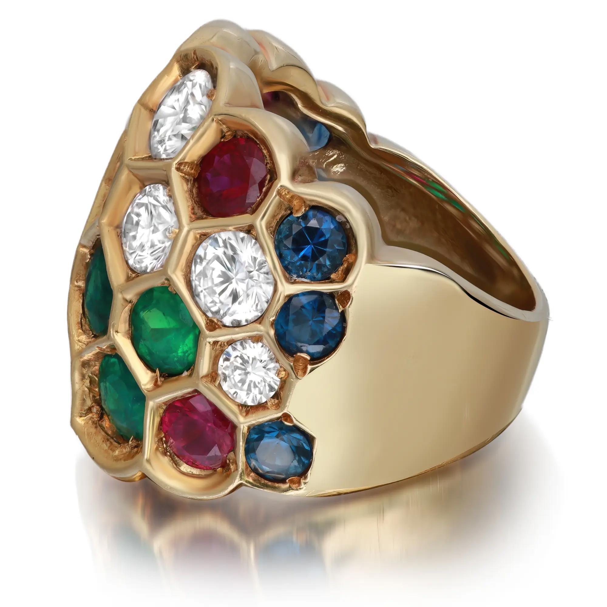 This multi colored gemstone cocktail band ring features hues of different gemstones in a decorative honeycomb pattern. Showcasing a stunning collection of gemstones like Emerald, Sapphire, Ruby and Diamond. Total diamond weight: 3.61 carats. Diamond