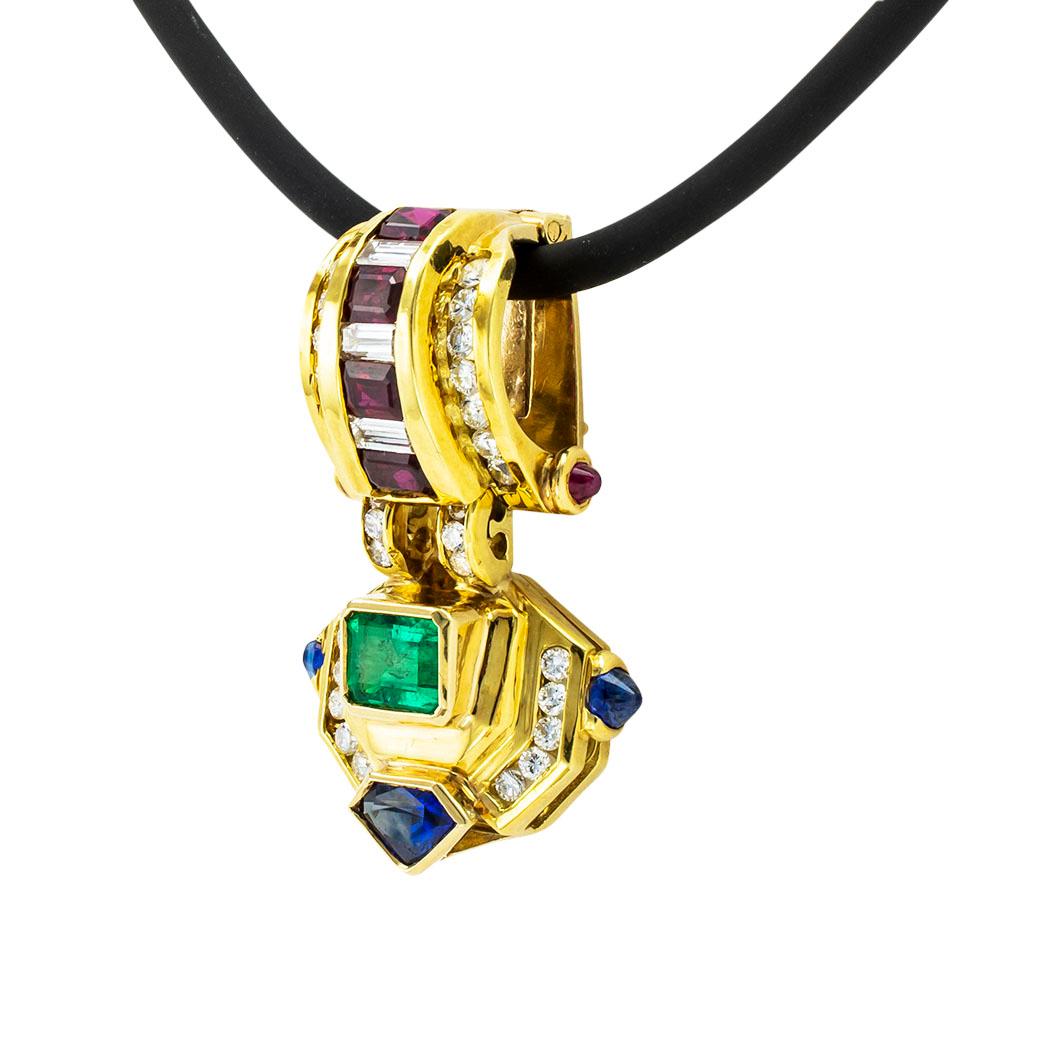 Emerald ruby sapphire diamond and yellow gold enhancer pendant circa 1980. *

ABOUT THIS ITEM:  #N-DJ68F. Scroll down for specifications.  All of the most precious gems known to mankind embellish this colorful and most attractive enhancer pendant. 