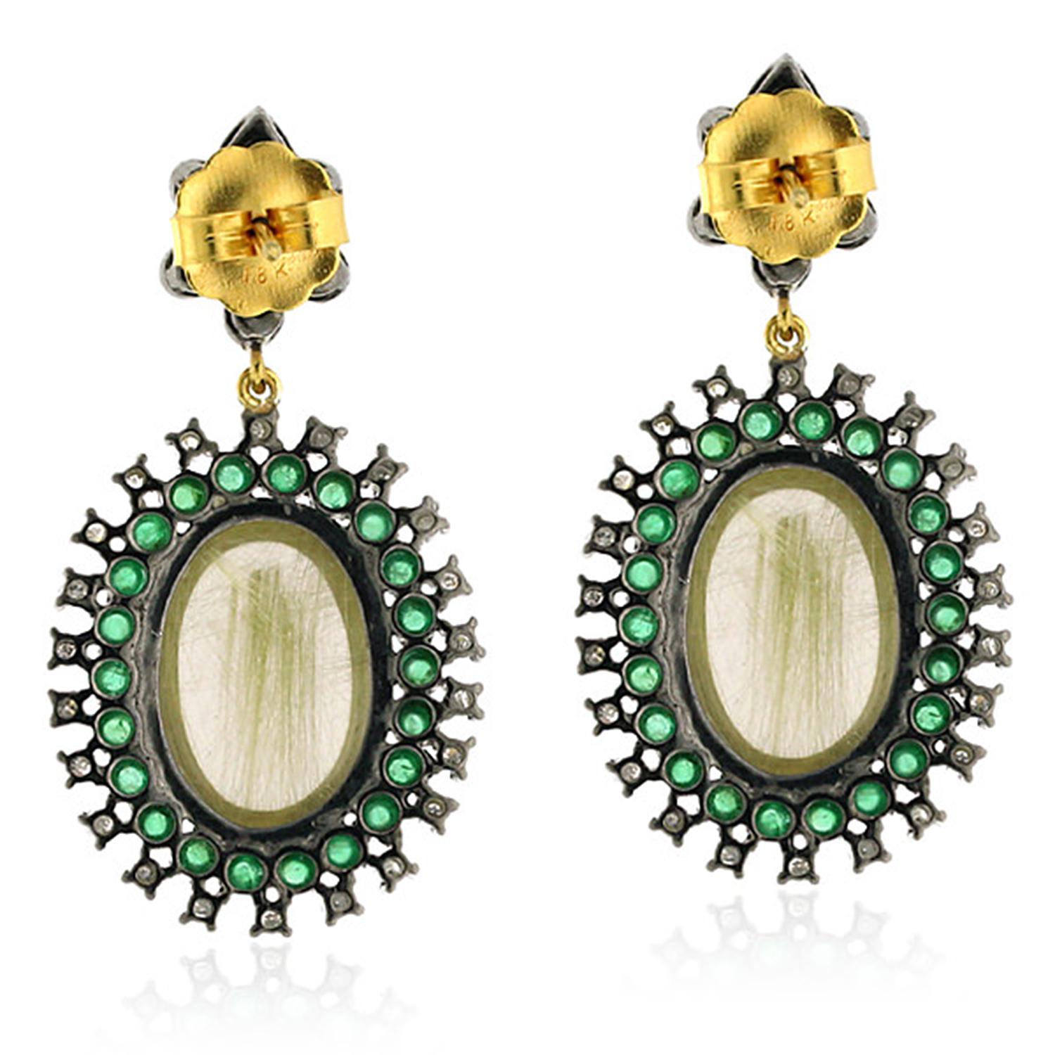 These beautiful earrings are handmade in 18-karat gold and sterling silver.  
It is set with 25.65 carats rutilated quartz, 1.65 carats emerald and 1.41 carats diamonds.

FOLLOW  MEGHNA JEWELS storefront to view the latest collection & exclusive