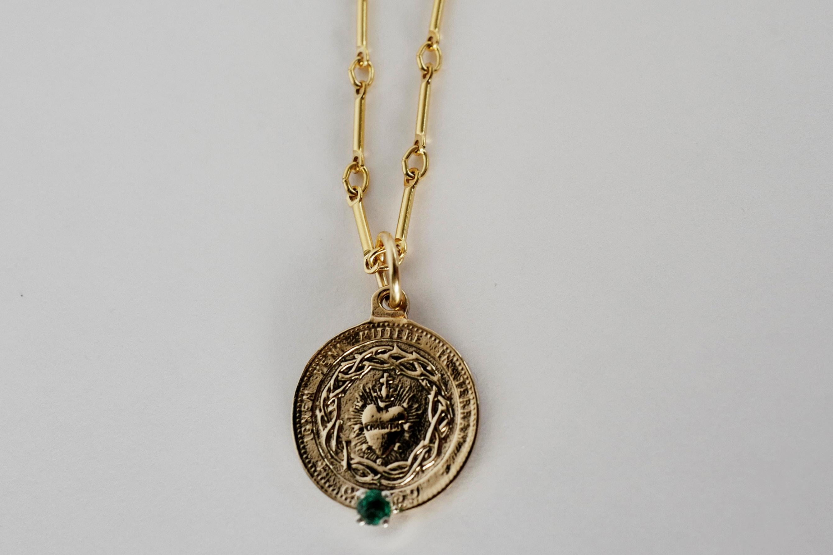 Emerald Sacred Heart Coin Medal Pendant Chain Necklace J Dauphin

The Sacred Heart (also known as the Sacred Heart of Jesus) has one of the deepest meanings in the Roman Catholic practice. The symbol represents Jesus Christ’s actual heart as His