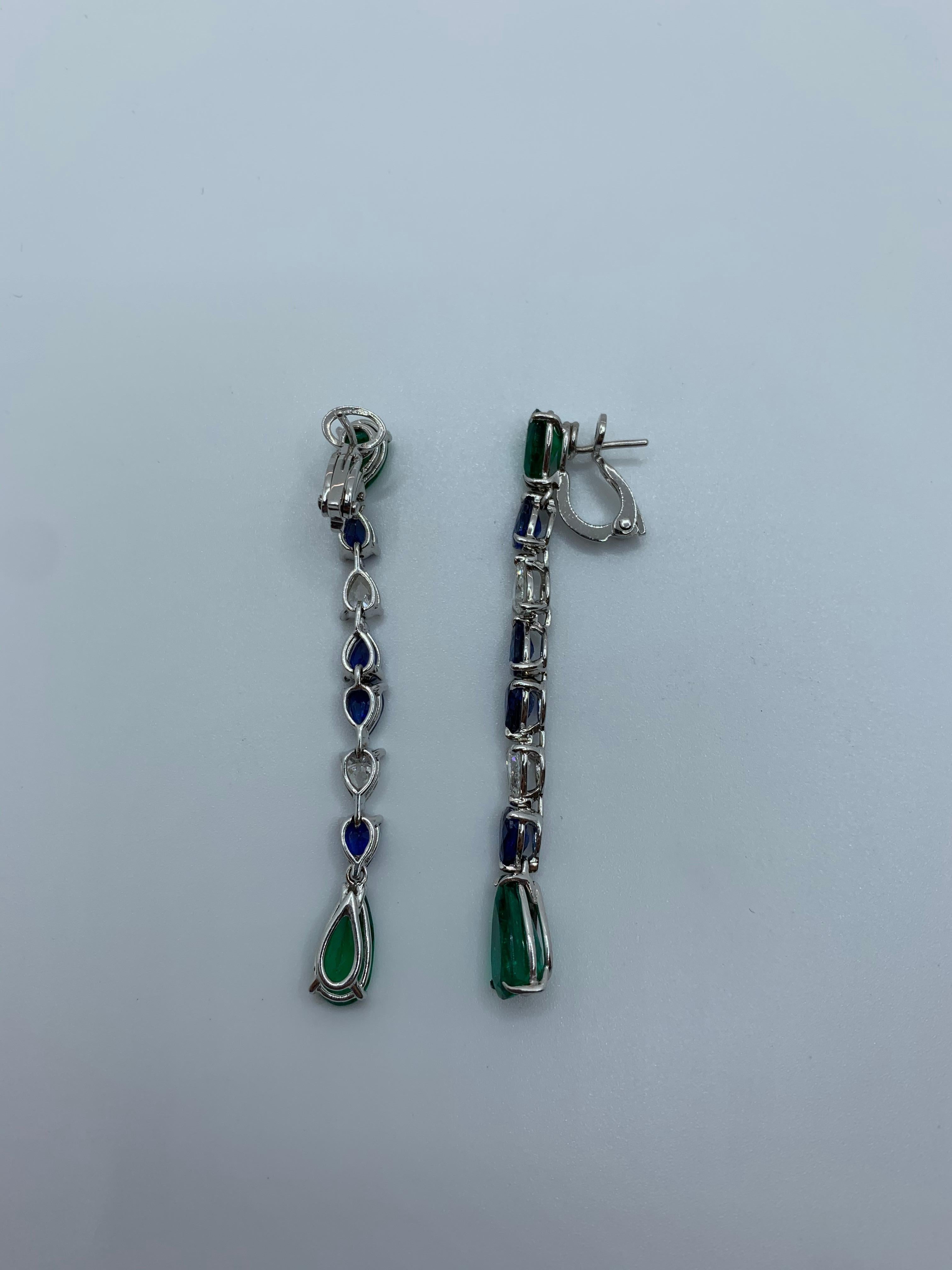 Pear Shaped Emerald, Sapphire and Diamond Earring. This Earring is part of a Suite and can be purchased individually.

Striking Earring and color combination. The gorgeous Colombian Emeralds matched with the beautiful Ceylon Sapphires play as if