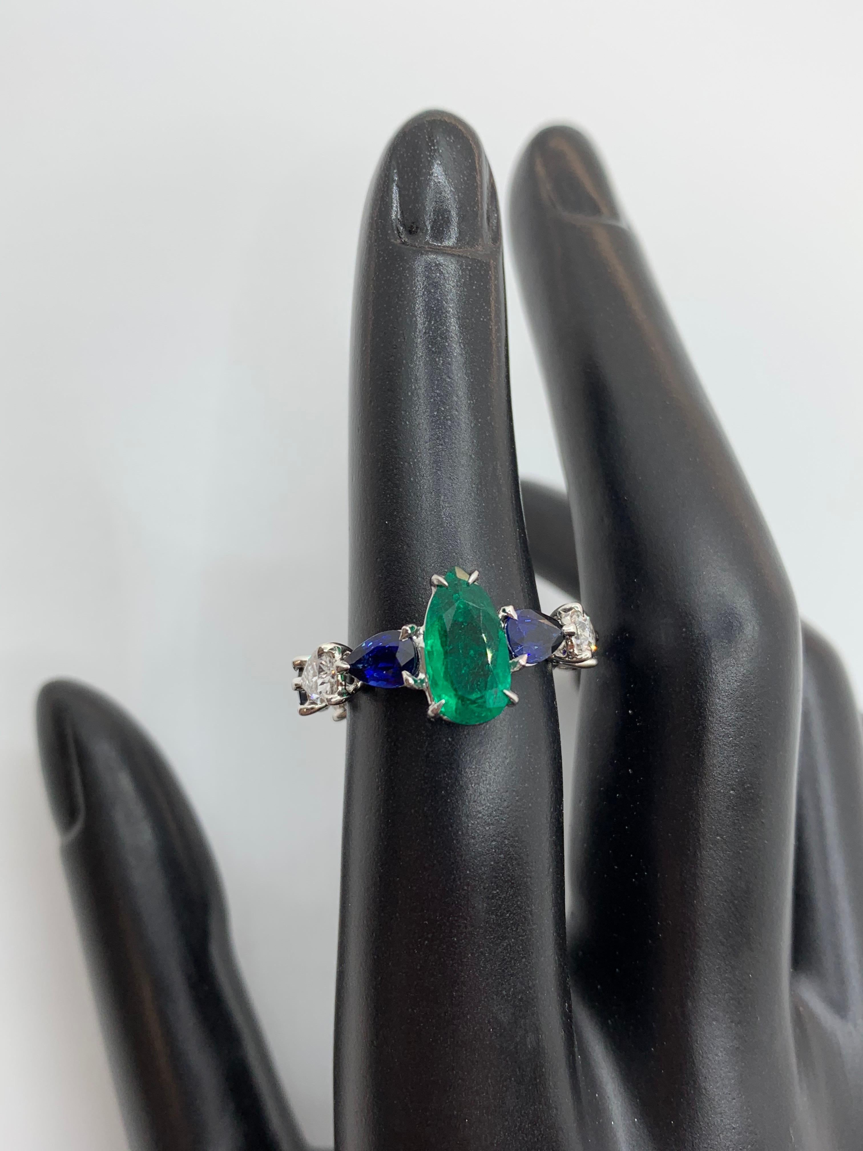pear cut sapphire ring with diamonds and emeralds