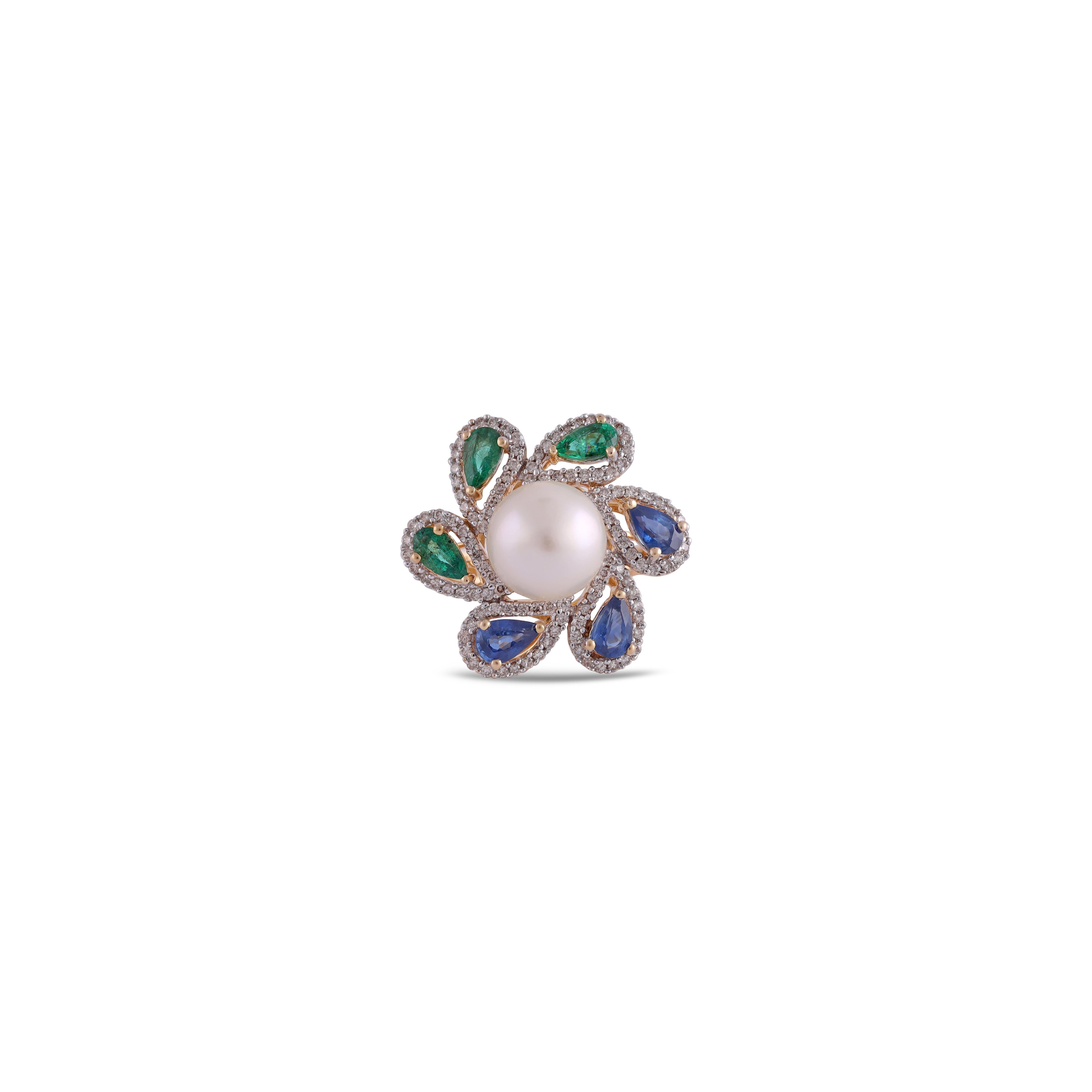 This is an elegant emerald, Sapphire, Pearl & diamond ring studded in 18k gold with 3 piece of  emerald weight 0.51 Carat, 3 piece of Sapphire 0.76 carat,  1 piece of Pearl 3.52 Carat. which is surrounded of 114 mix shaped diamonds weight 0.43 carat