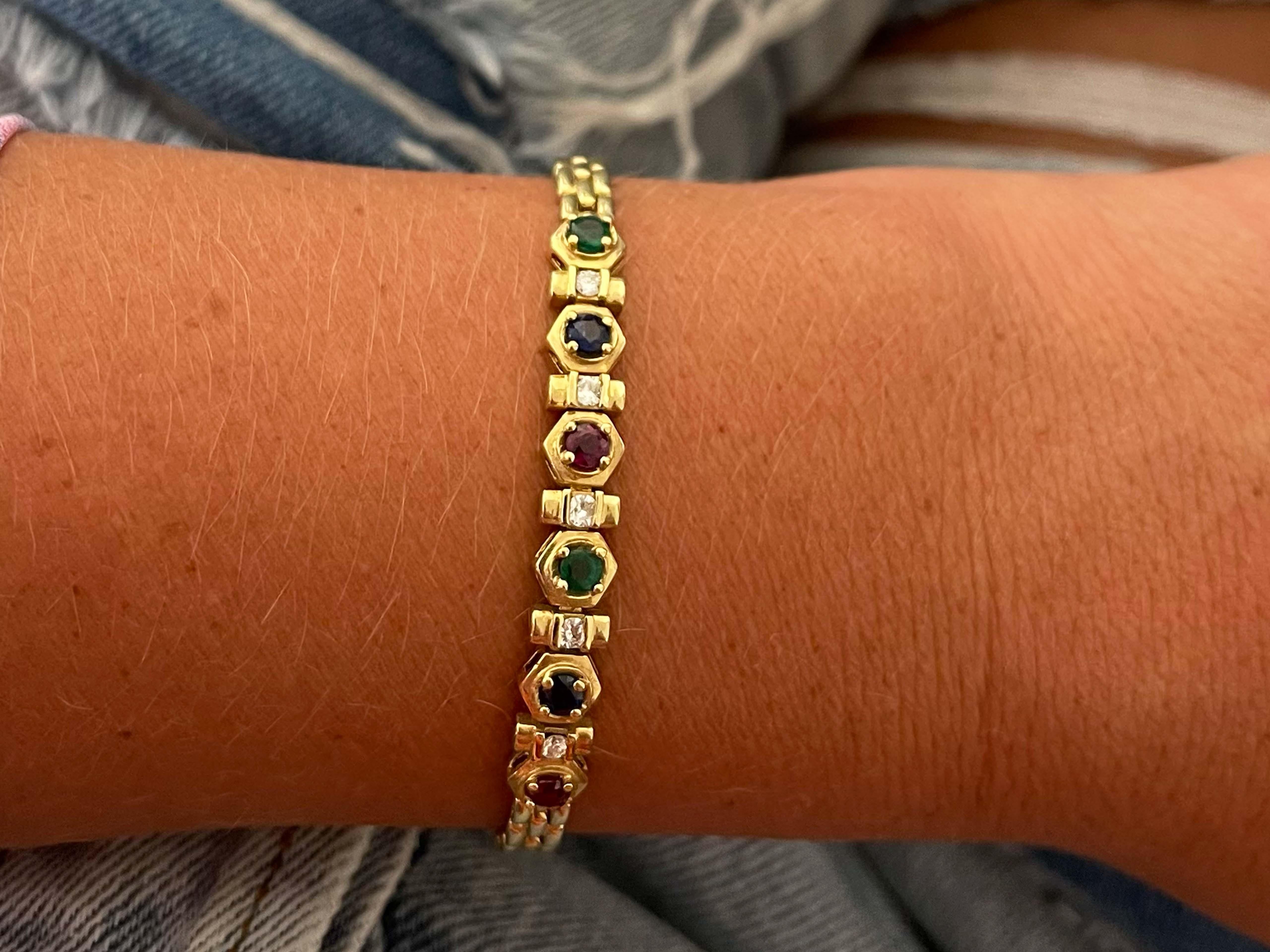 Bracelet Specifications:

Metal: 18k Yellow Gold

Gemstones: 2 red rubies, 2 green emeralds and 2 blue sapphires

Gemstones Total Carat Weight: ~0.60 carats

Diamond Count: 5

Diamond Carat Weight: 0.25

Diamond Color: H

Diamond Clarity: