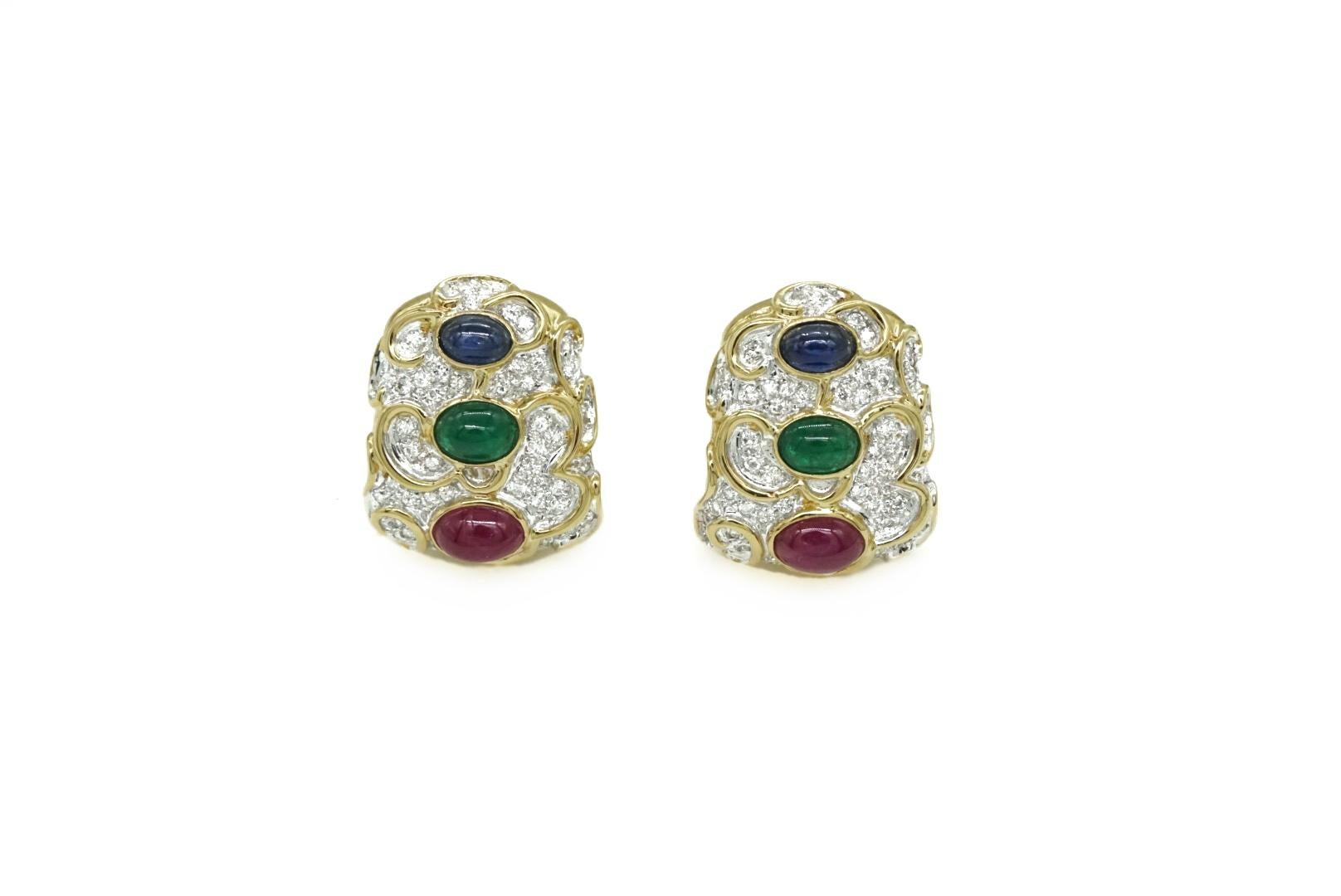 An Emerald, Sapphire, Ruby and Diamond Earrings in 18k Yellow Gold. Made in the US, circa 1970.
Set with app. 2.50 ct of Diamonds 
E-F Color, VVS-VS Clarity 
Along with app. 4.00 ct of Emeralds, Sapphire and Rubies 
1 inch in Length 