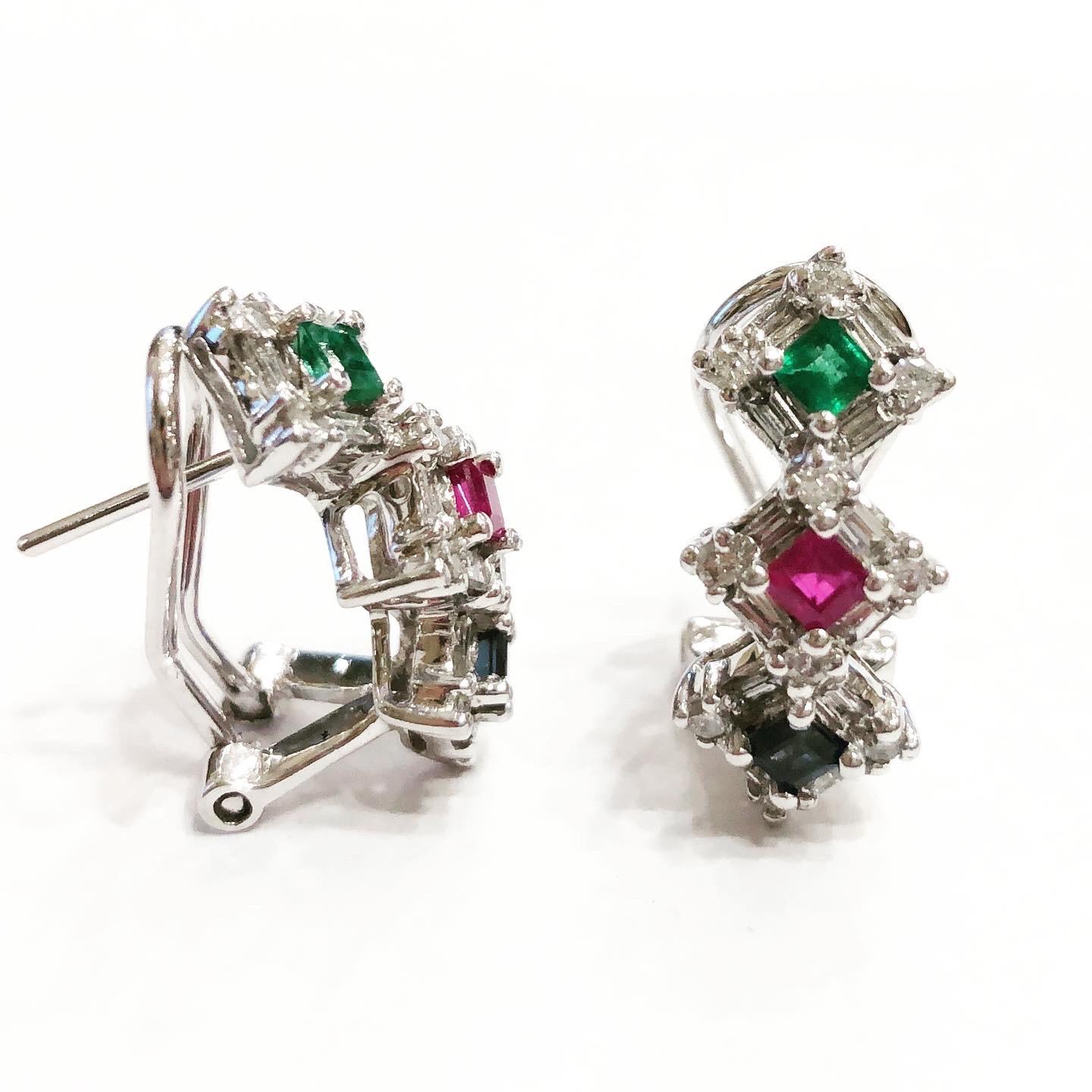 Lovely Emerald, Sapphire, Ruby and Diamond half hoop clipon 14k gold earrings.
Condition: Good..
14 karat white gold.
Square cut ruby, sapphire and Emeral.
Brilliant and baguette cut diamonds.
Diamond approximate carat weight: 1.5 carat.
Ruby