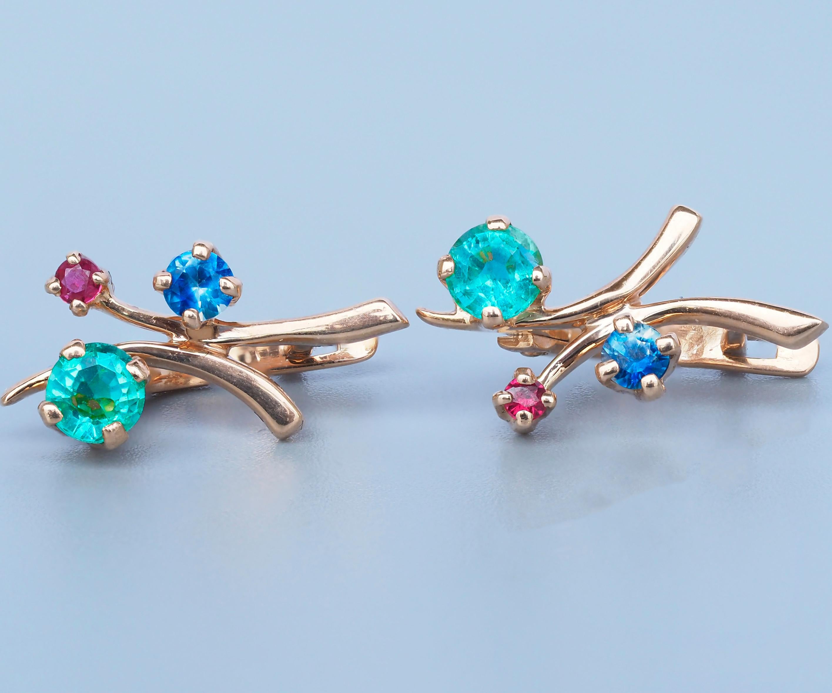 Emerald, sapphire, ruby earrings in 14k gold. Tiny gold earrings. Young girl earrings. Emerald earrings.

Metal: 14k solid gold
Weight: 2.2 g  
Size: 12x8mm

Gemstones:
Emerald, green color, round cut, 0.60 ct weight approx, si clarity (small