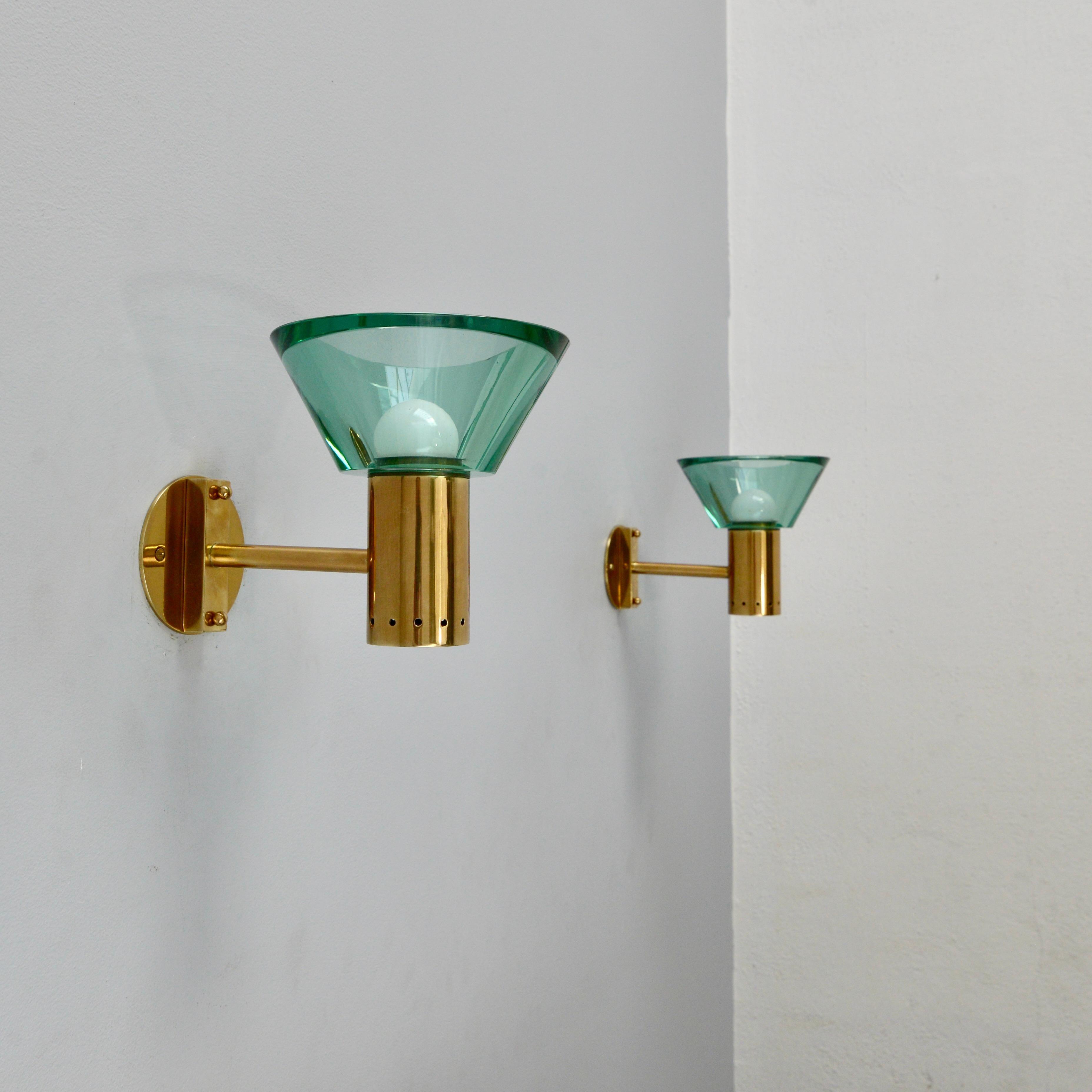 Pair of beautiful emerald glass and brass torchiere Seguso sconces from Italy. True tone of glass is represented with the light on. Fully restored. Brass and glass. Sold as a pair. 1-E26 light bulb supplied upon request per sconce.
Measurements: 7