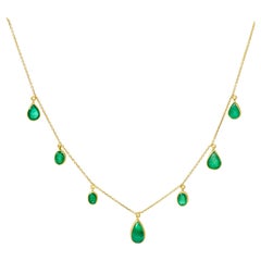 Emerald Set in 18kt Gold Garland Hanging on a 18kt Gold Chain