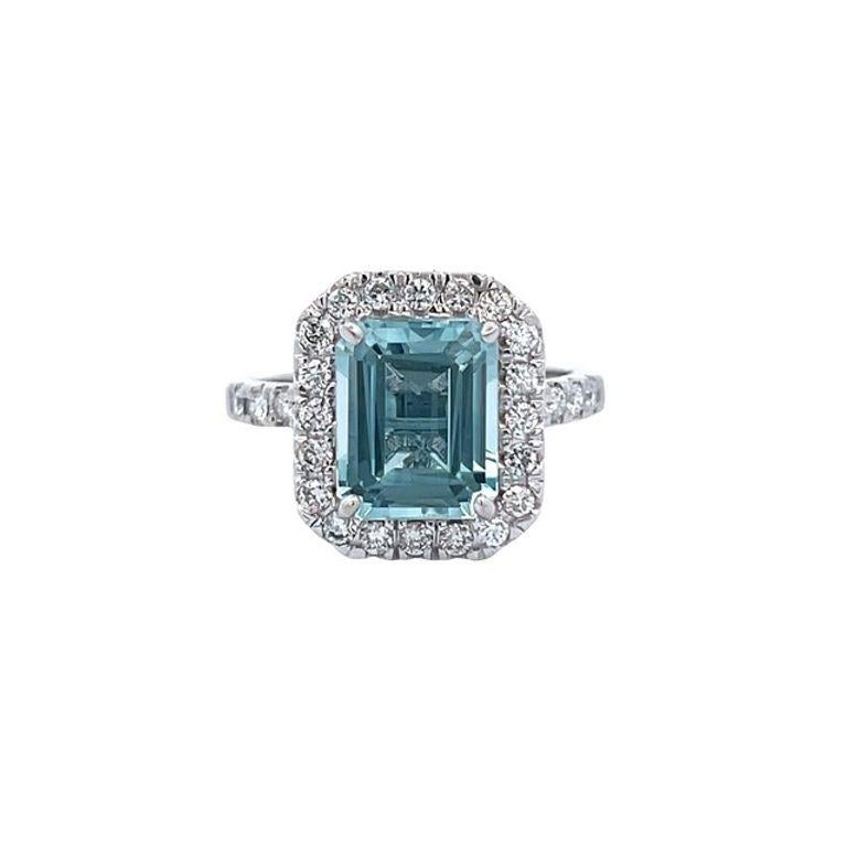 Indulge in the beauty of true love with our striking cocktail ring, meticulously crafted to feature a mesmerizing emerald aquamarine gemstone that glistens with every movement. This magnificent ring boasts a stunning 3.01-carat aquamarine as its
