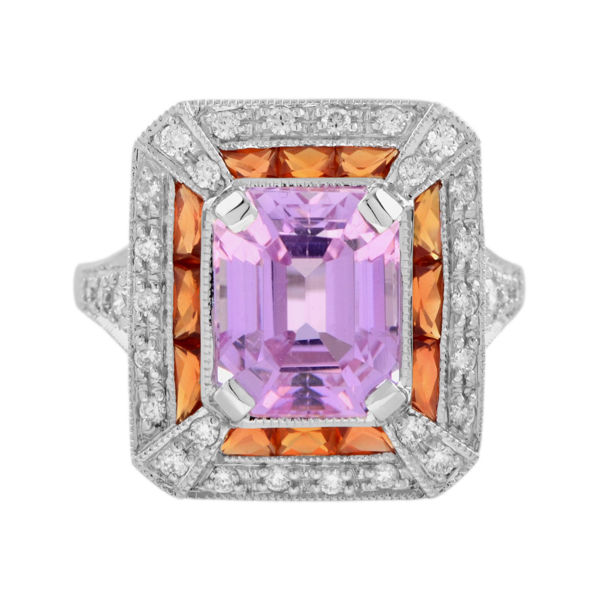 Make a powerful statement in pink. This Art Deco inspired 14k white gold ring features a perfect sparkly emerald cut pink kunzite set into an octagon shape setting. The center stone is framed in French cut orange sapphires, finished with outer