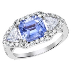 18 Karat Gold Emerald Shaped Ceylon Sapphire Trillion Diamonds Cocktail Ring