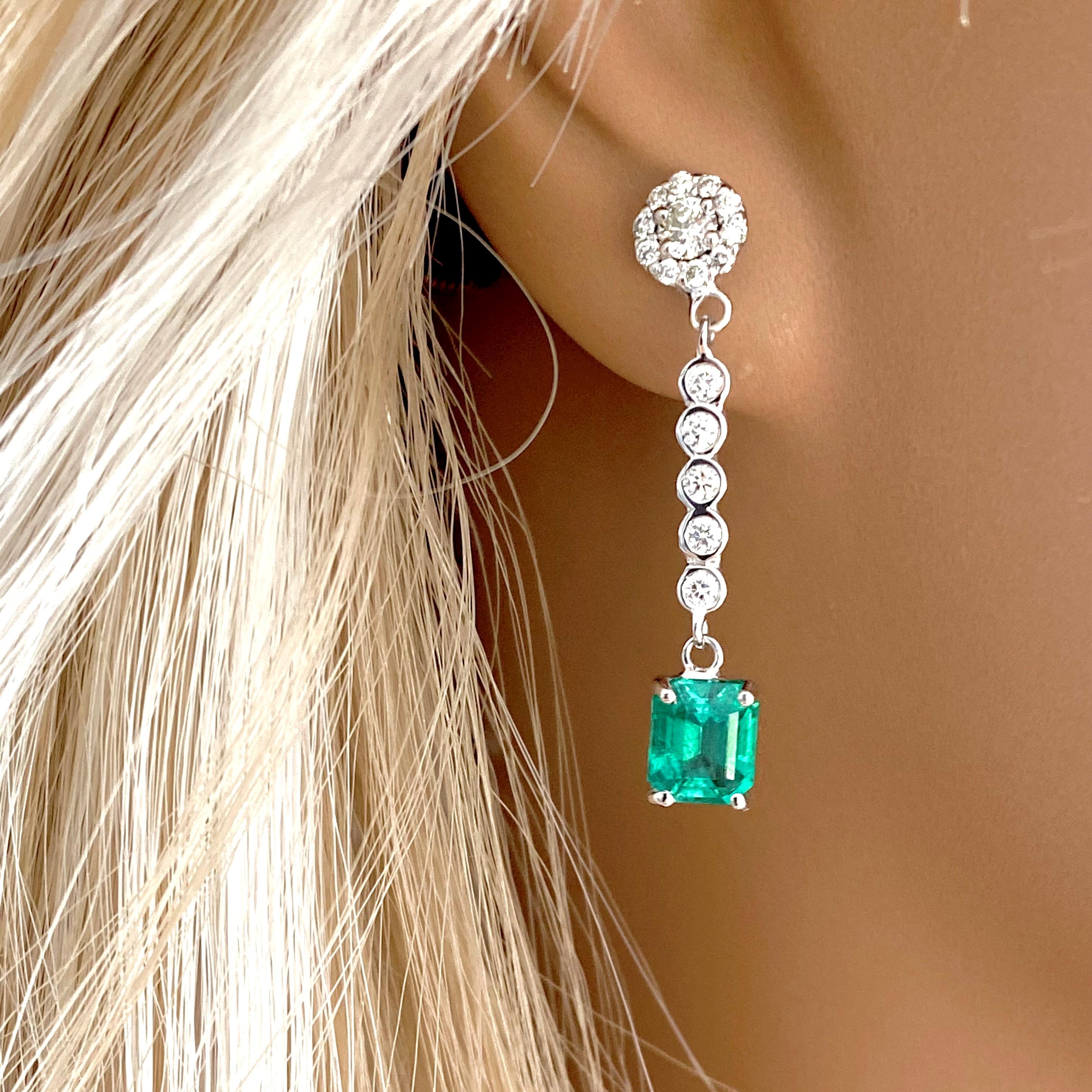 Emerald Shaped Emerald and Halo Diamond Cluster White Gold Drop Earrings  In New Condition In New York, NY