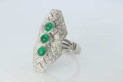 Emerald shield ring. Platinum Shield Ring Emerald Cabochon and Diamond wide band