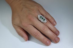 Emerald shield ring. Platinum Shield Ring Emerald Cabochon and Diamond wide band